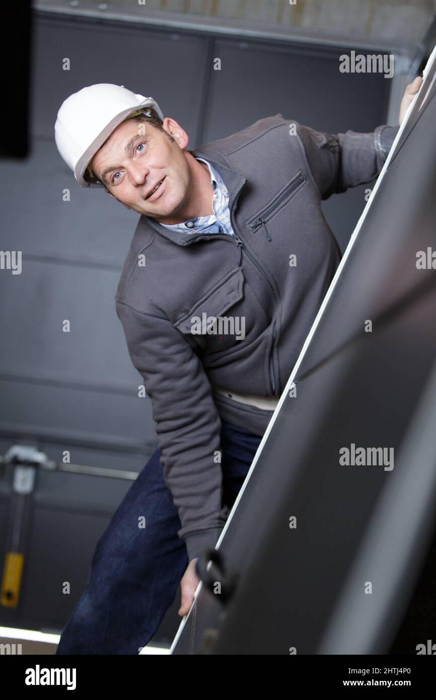 Builder holding water level hi-res stock photography and images - Alamy