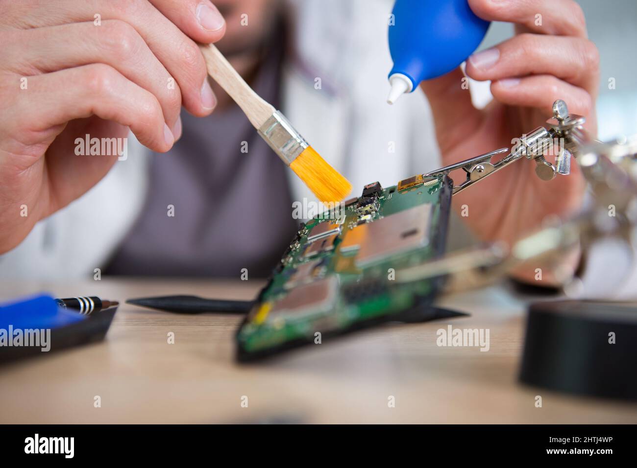 technician removing dust from computer components Stock Photo Alamy
