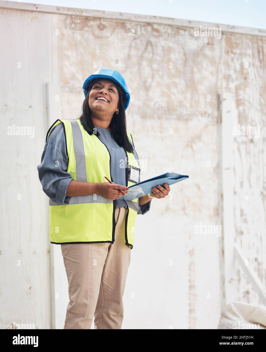Making sure everything is up to code. Cropped shot of an attractive ...