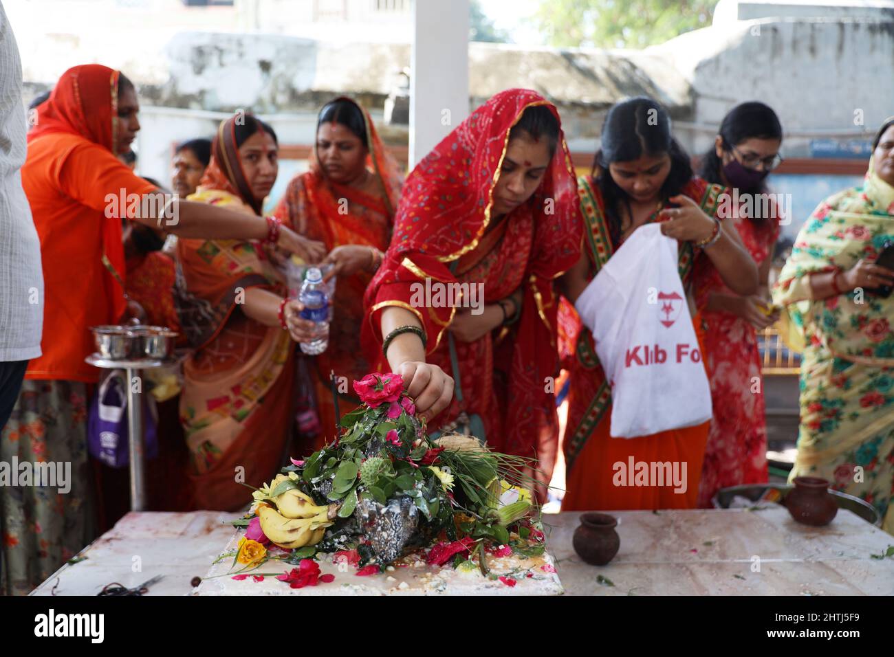 Chennai, Tamil Nadu, India. 1st Mar, 2022. Hindu devotees perform rituals of pouring milk and water onto a Shiva Lingam, a stone sculpture representing Hindu Lord Shiva, on the occasion of the Maha Shivratri festival at a temple in Chennai. (Credit Image: © Sri Loganathan/ZUMA Press Wire) Stock Photo