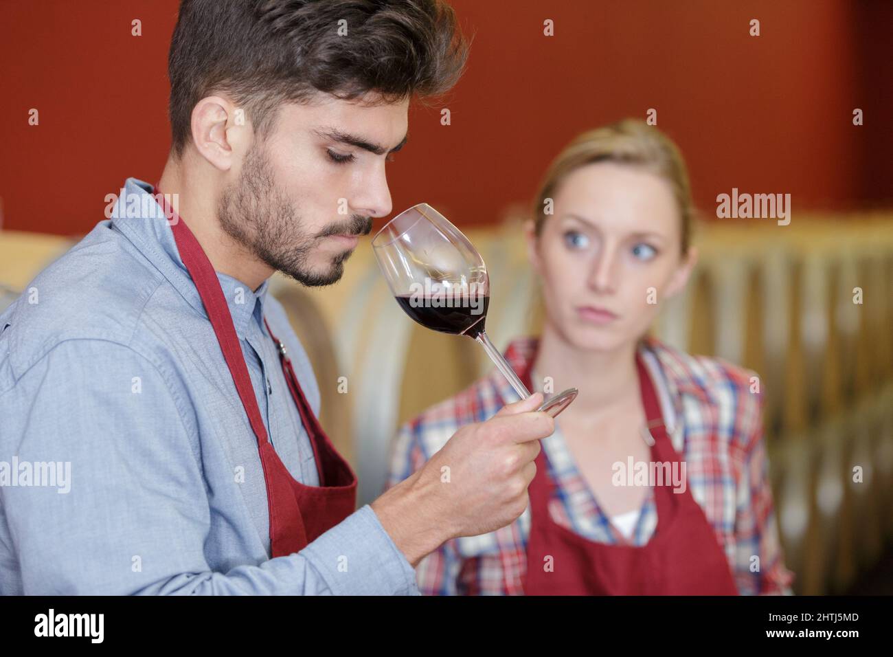 a man smelling red wine Stock Photo - Alamy