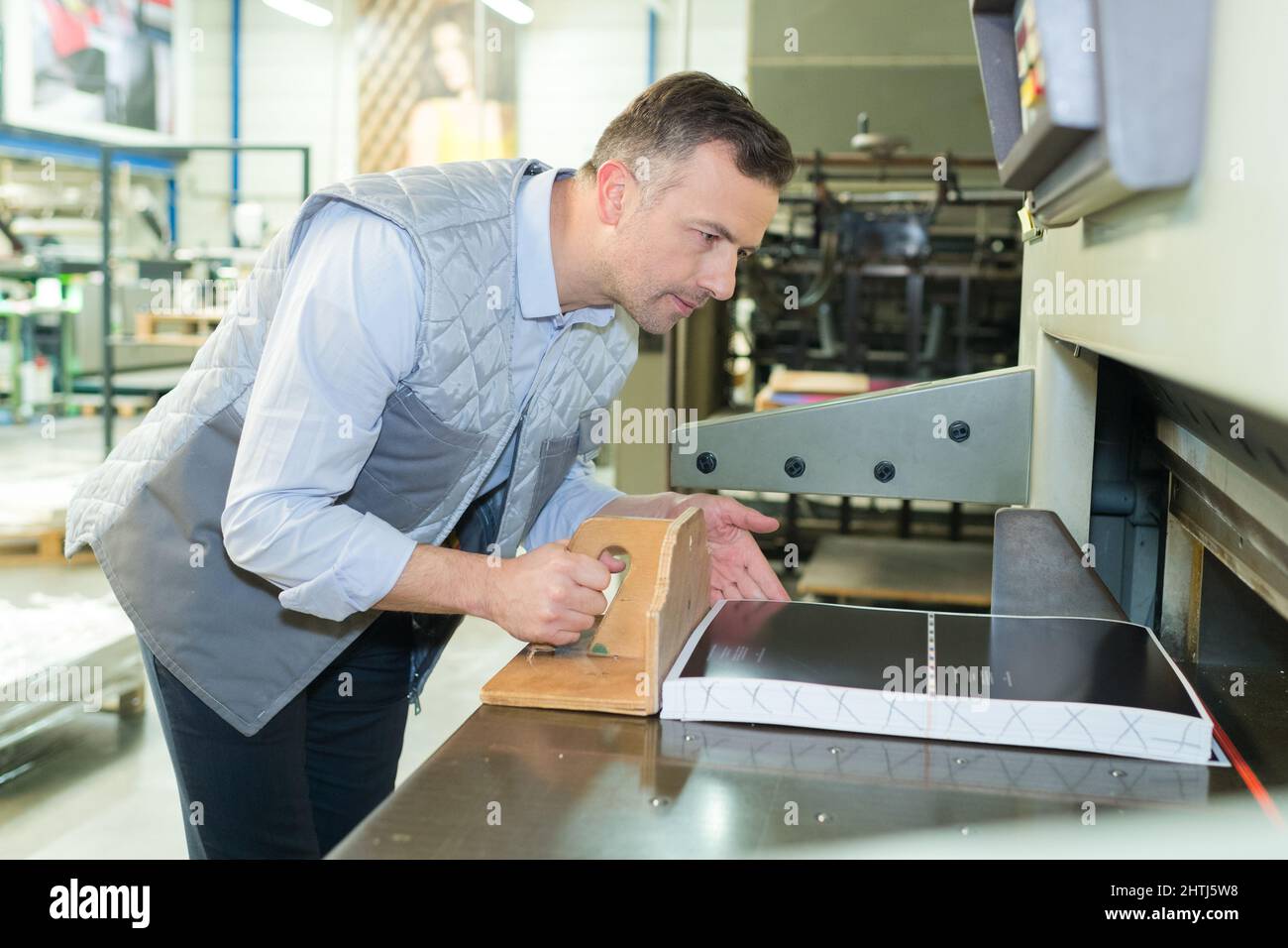 man printing press cutting machine Stock Photo Alamy
