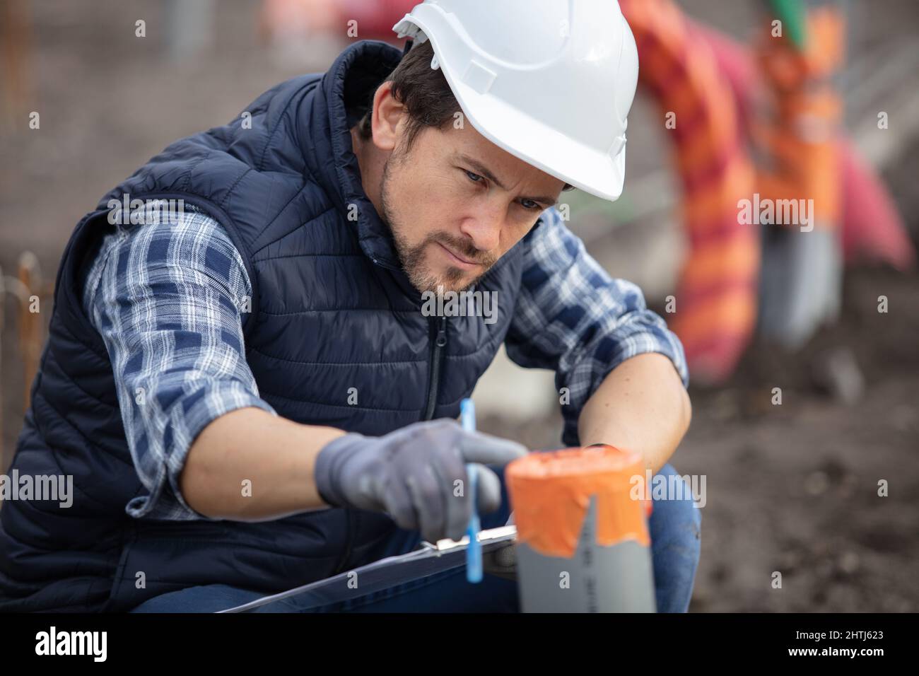 builder working on leveled and raked soil base Stock Photo - Alamy