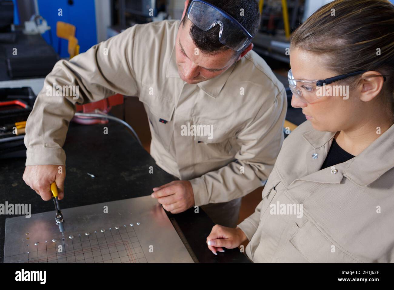 two welder workers assembling parts Stock Photo Alamy