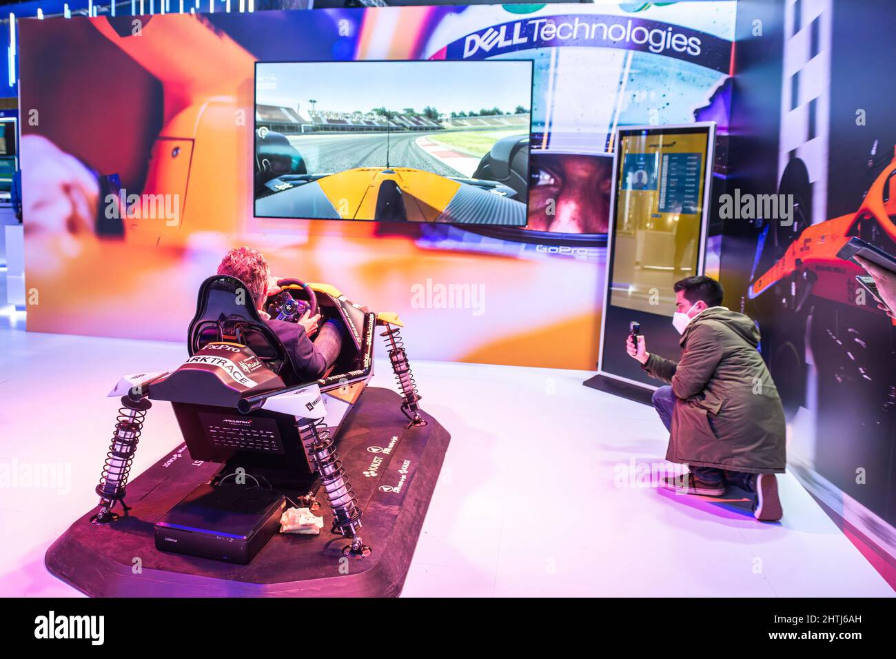 Barcelona, Spain. 28th Feb, 2022. A customer seen testing a car simulator at a Dell booth during the first day of Mobile World Congress 2022 (MWC) at the Fira de Barcelona. Credit: SOPA Images Limited/Alamy Live News Stock Photo
