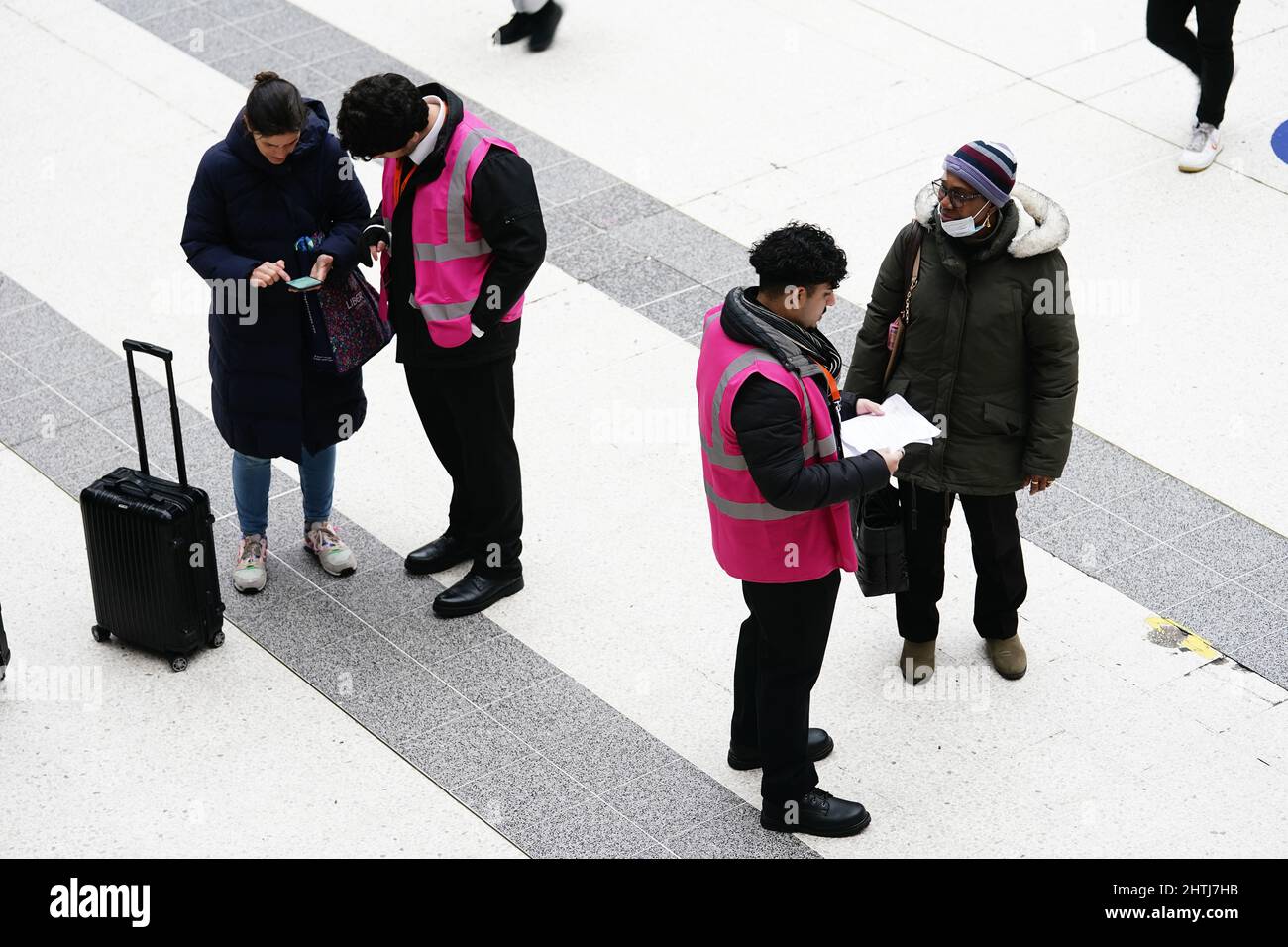 Staff at Liverpool Street station in central London help travellers ...