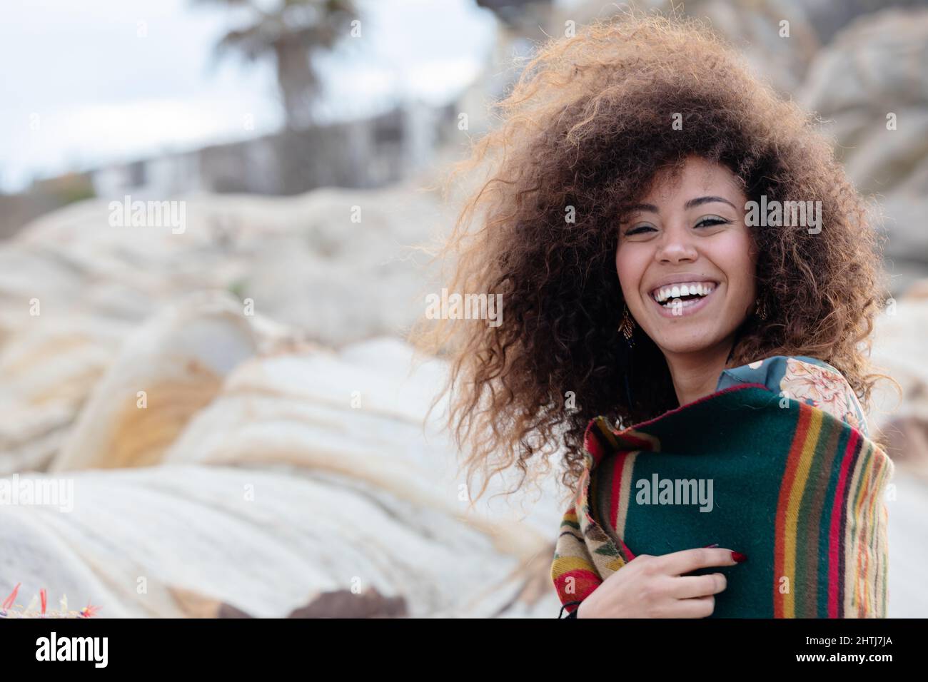 A young beautiful woman in a beach in winter Stock Photo - Alamy