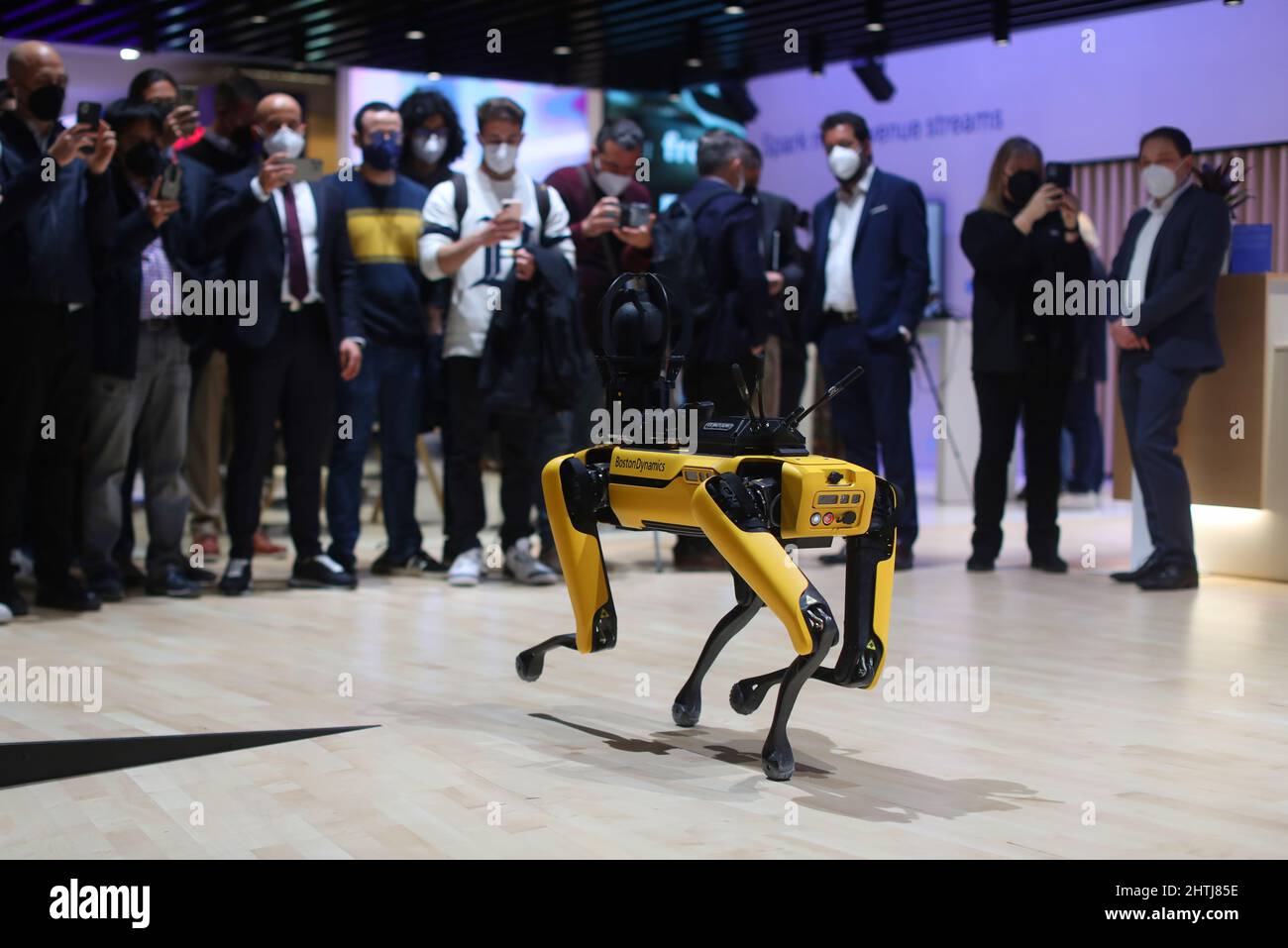 Barcelona, Spain. 28th Feb, 2022. Visitors look at the Boston Dynamics' Spot Robot Dog on the opening day of the Mobile World Congress (MWC), the annual trade show organised by GSMA at the Fira de Barcelona, Spain. Stock Photo