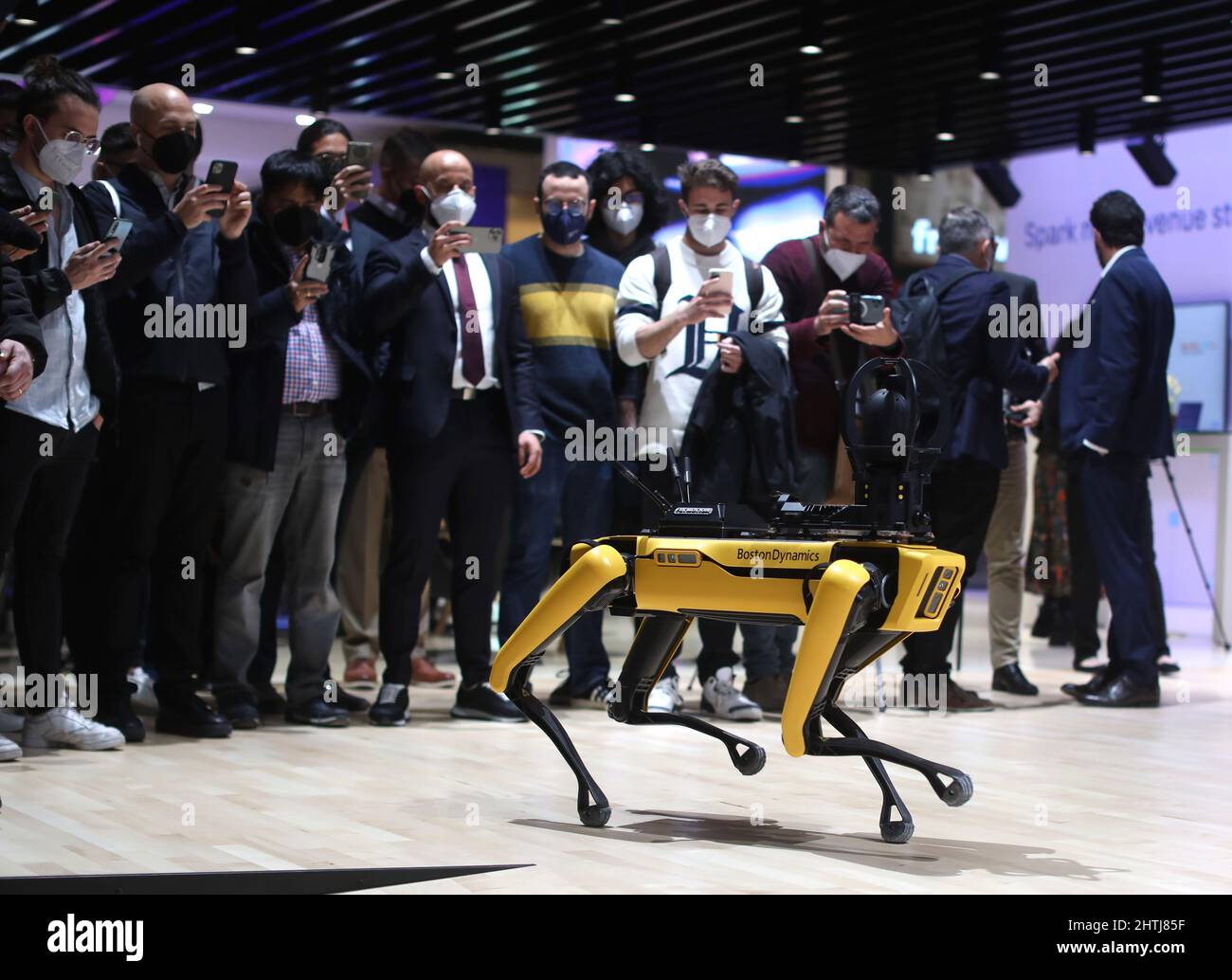 Barcelona, Spain. 28th Feb, 2022. Visitors look at the Boston Dynamics' Spot Robot Dog on the opening day of the Mobile World Congress (MWC), the annual trade show organised by GSMA at the Fira de Barcelona, Spain. Stock Photo
