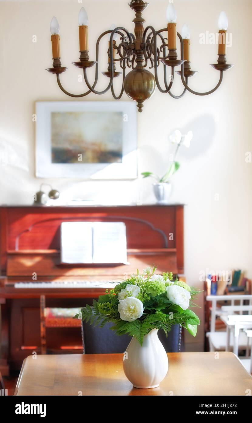 Flowers in the house. A warm photo of flower and dinning room (Danish). Stock Photo