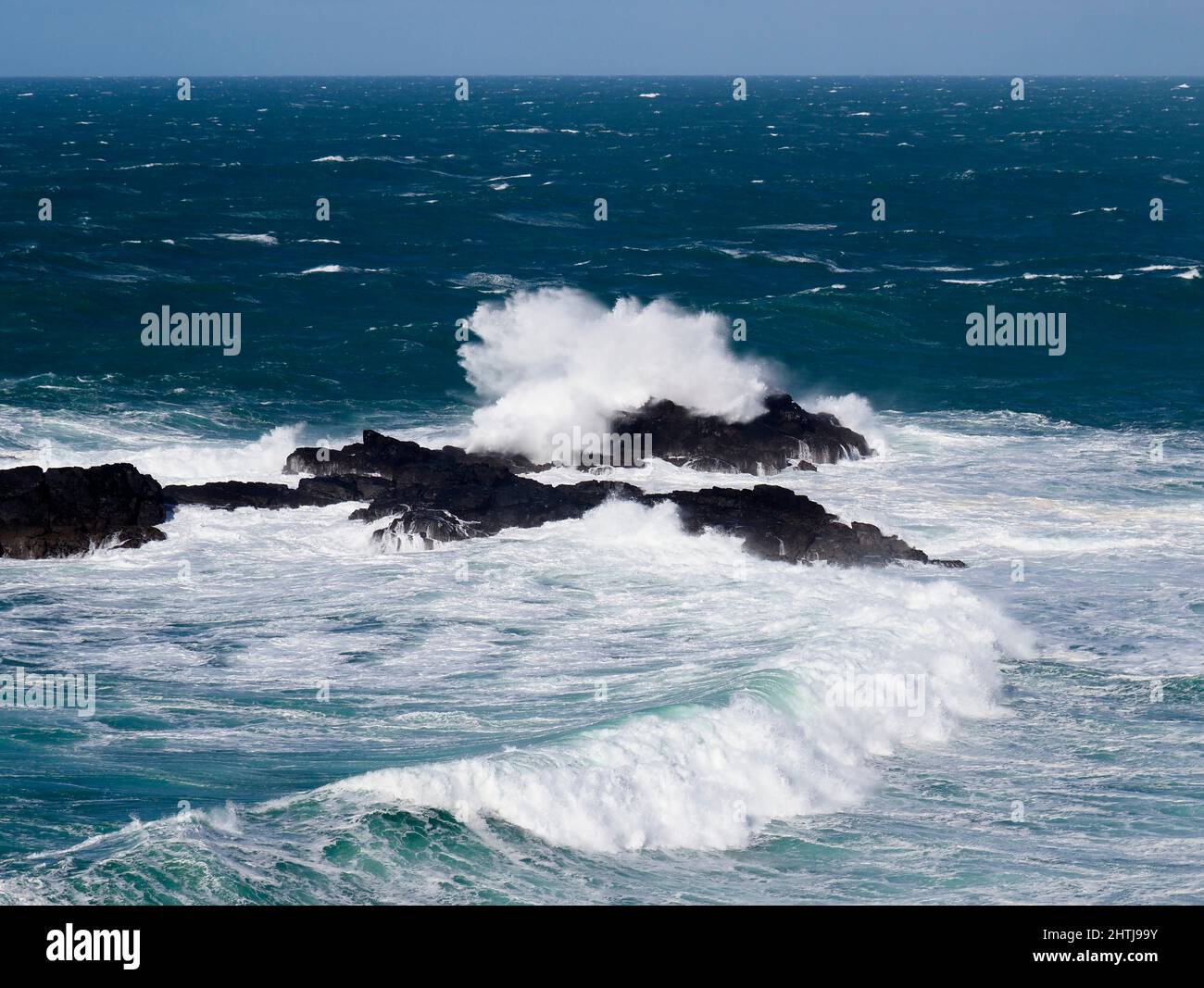 Waves breaking on The Carracks rocks between Zennor and St Ives, Cornwall Stock Photo