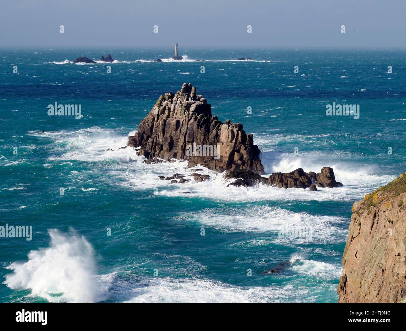 Armed Knight rock and Longships lighthouse from Land's End, Cornwall Stock Photo