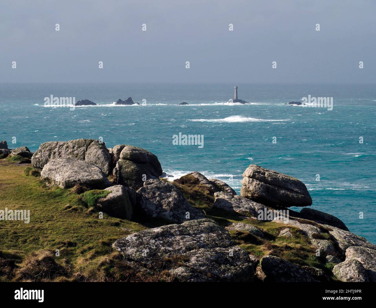 Longships lighthouse from Land's End, Cornwall Stock Photo