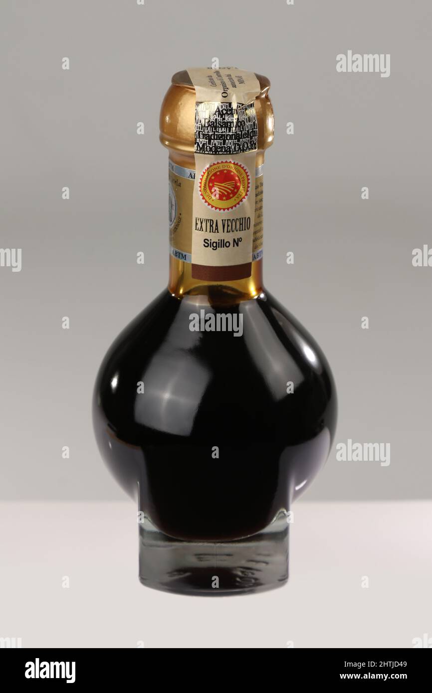 Modena, Italy, year 2022, Balsamic vinegar of Modena, Italy, official glass bottle of consortium containing special sweetening of Modena Stock Photo