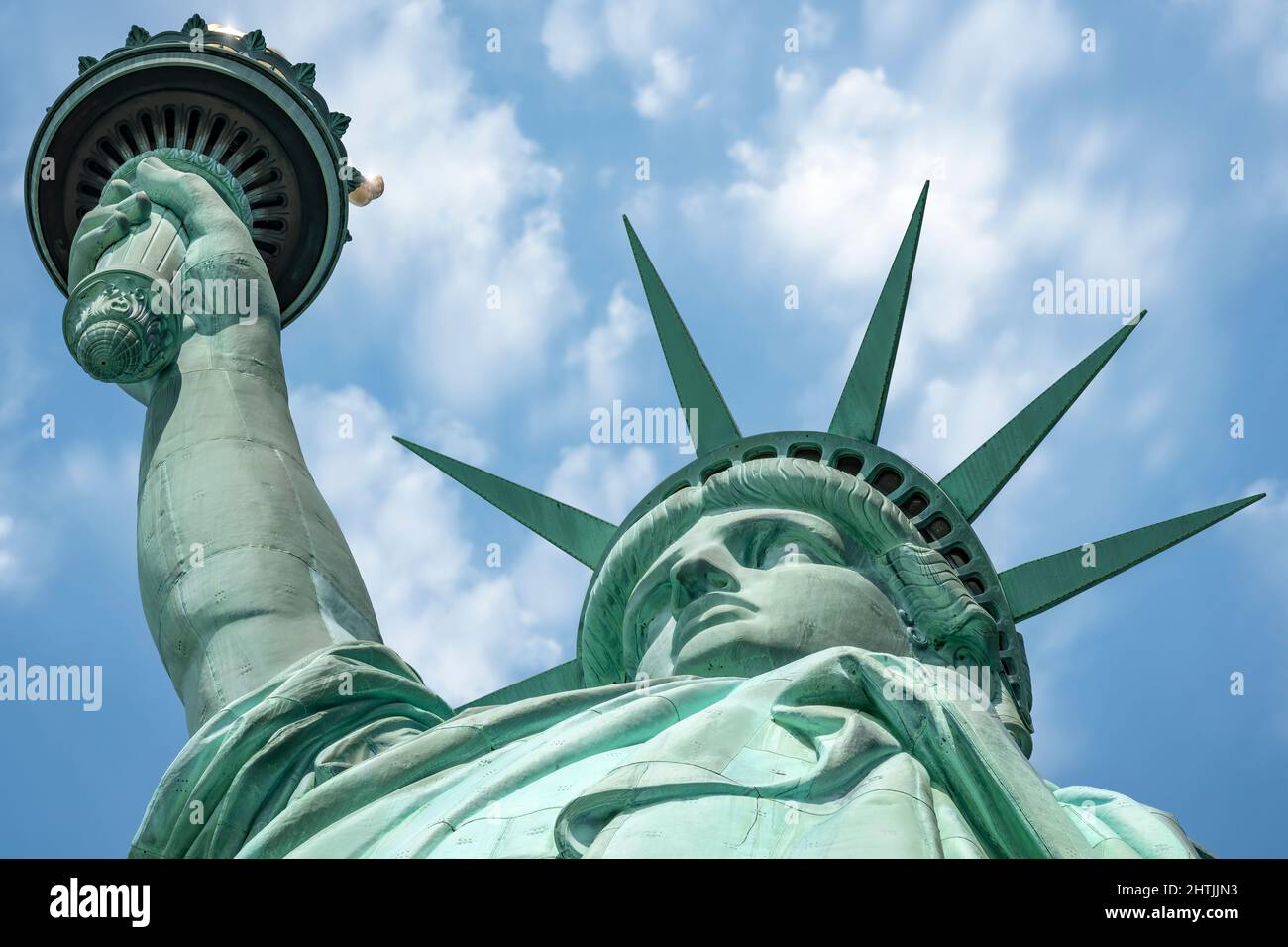 The Statue of Liberty standing on Liberty Island in the middle of New York Harbor, Manhattan, New York - USA. Stock Photo