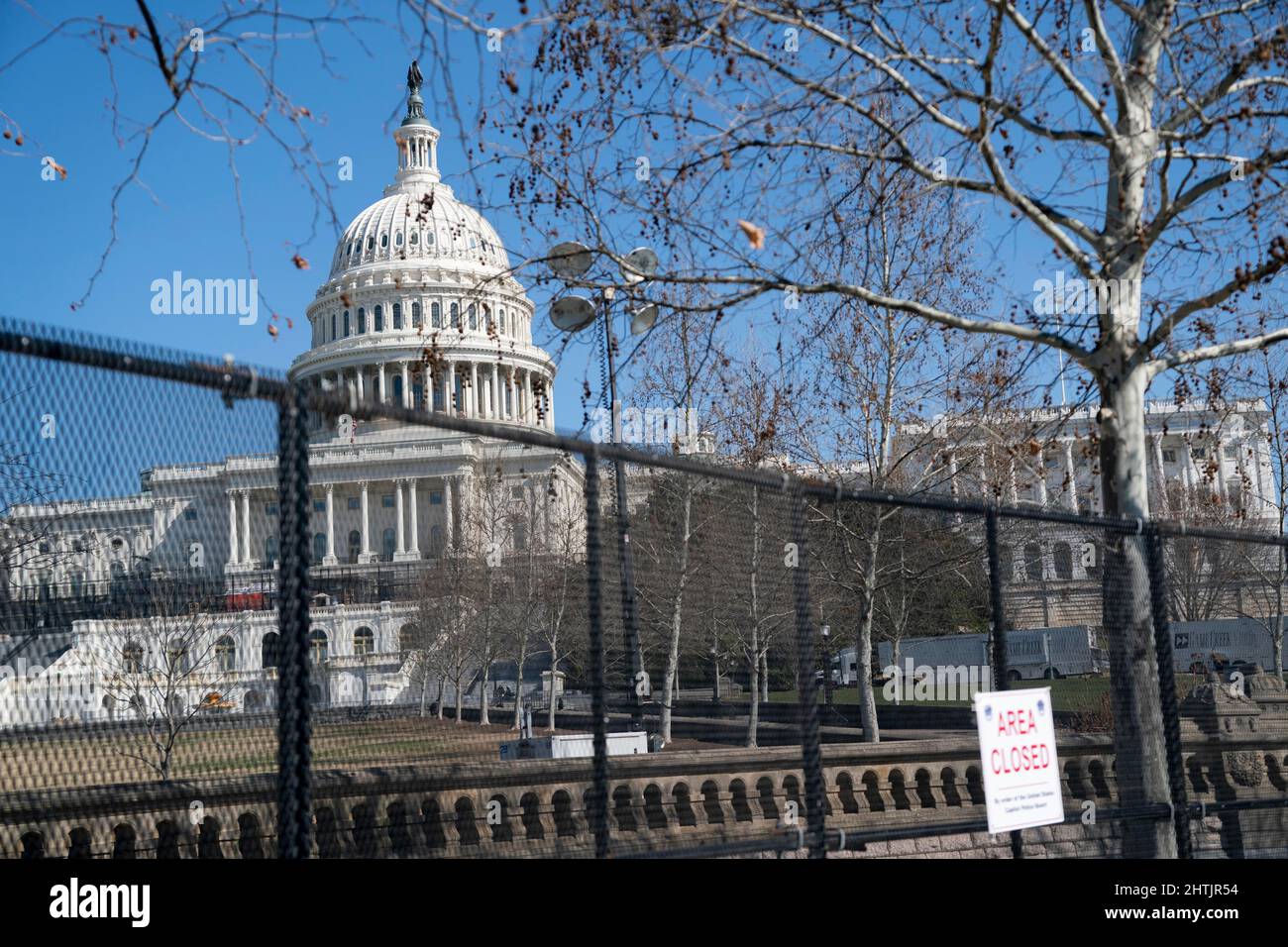 (220301) -- WASHINGTON, D.C., March 1, 2022 (Xinhua) -- Photo taken on Feb. 28, 2022 shows the U.S. Capitol building, seen through a barrier fence, in Washington, DC, the United States. Fencing has been reinstalled around the U.S. Capitol ahead of President Joe Biden's State of the Union address slated for Tuesday night. (Xinhua/Liu Jie) Credit: Liu Jie/Xinhua/Alamy Live News Stock Photo