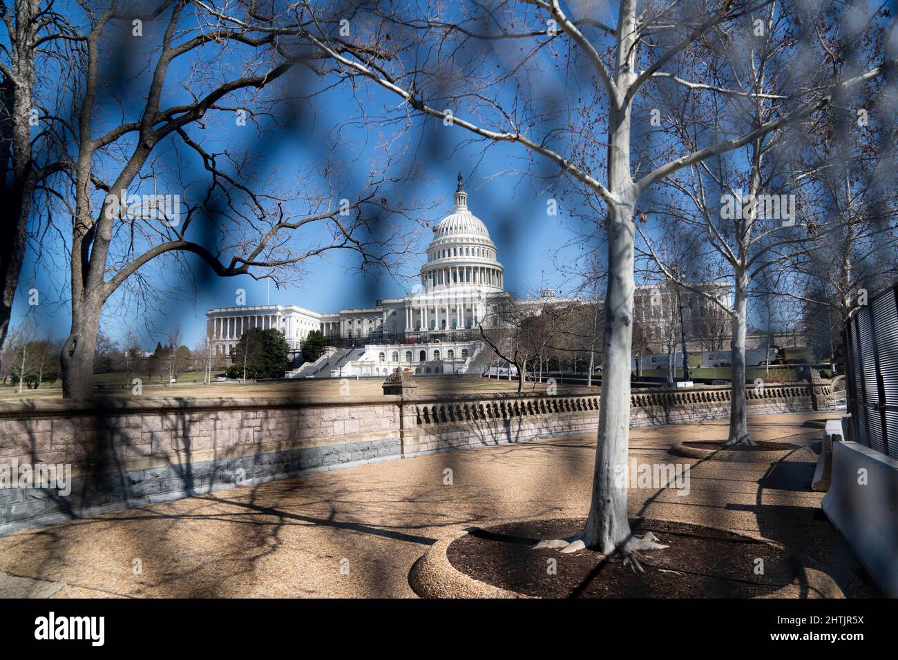 (220301) -- WASHINGTON, D.C., March 1, 2022 (Xinhua) -- Photo taken on Feb. 28, 2022 shows the U.S. Capitol building, seen through a barrier fence, in Washington, DC, the United States. Fencing has been reinstalled around the U.S. Capitol ahead of President Joe Biden's State of the Union address slated for Tuesday night. (Xinhua/Liu Jie) Credit: Liu Jie/Xinhua/Alamy Live News Stock Photo