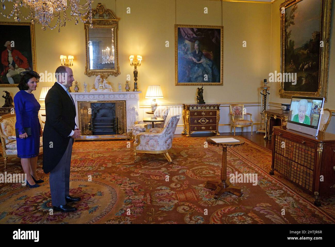 Britain's Queen Elizabeth appears via videolink from Windsor Castle, where  she is in residence, during a virtual audience to receive the Ambassador of  Andorra, Carles Jordana Madero and Soraia Maria Valls Pinilla