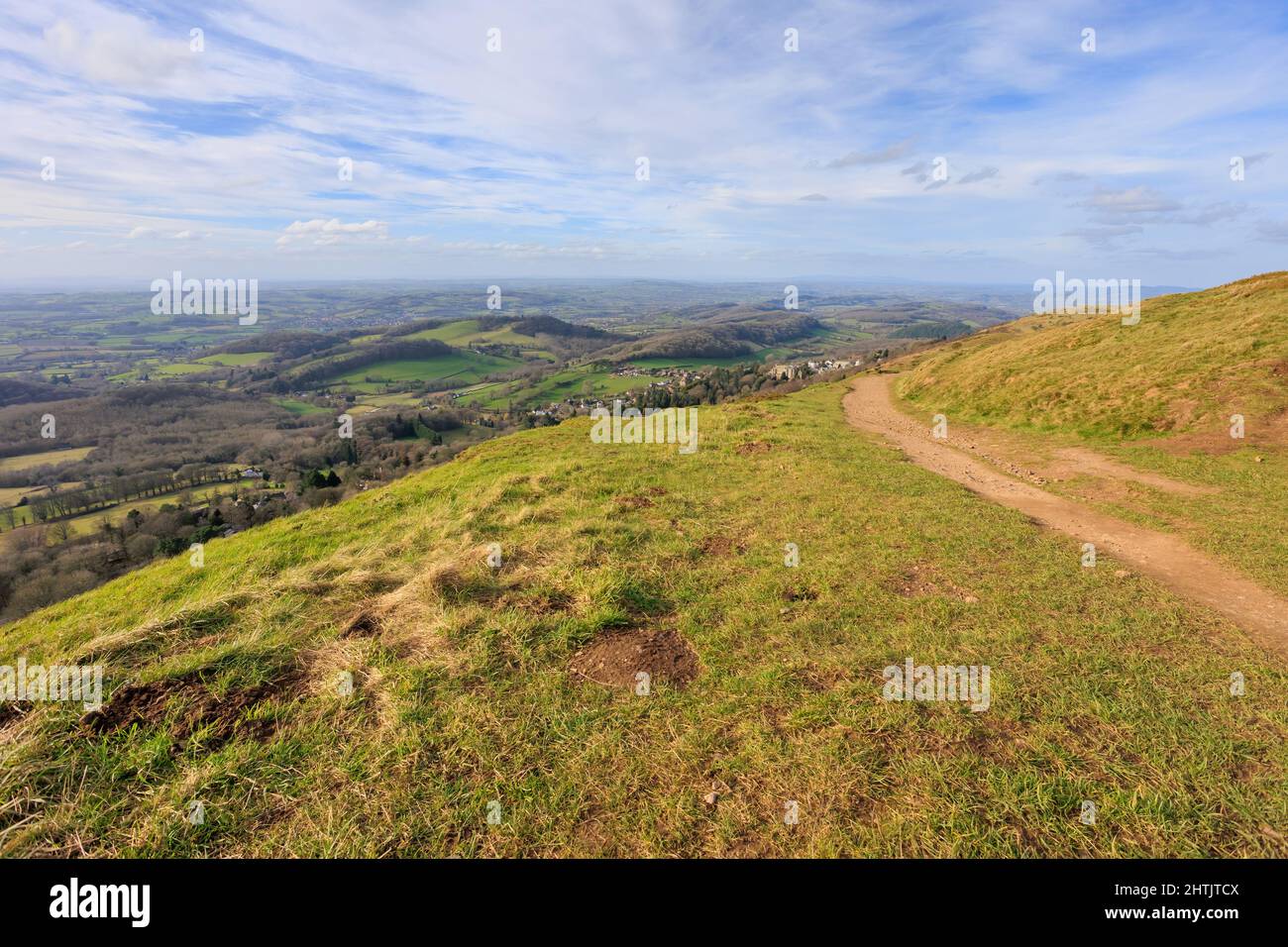 Views along the ridge top of the Malvern Hills in Worcestershire and Hereford with sunny skies and clear footpaths. Stock Photo