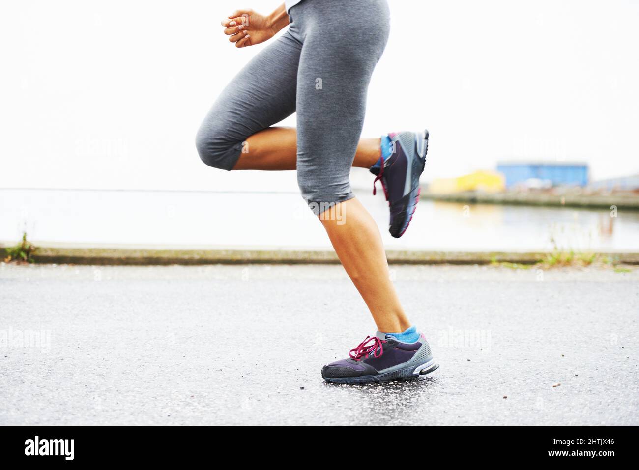 Feeling the burn of a great run. Cropped view of a womans legs while