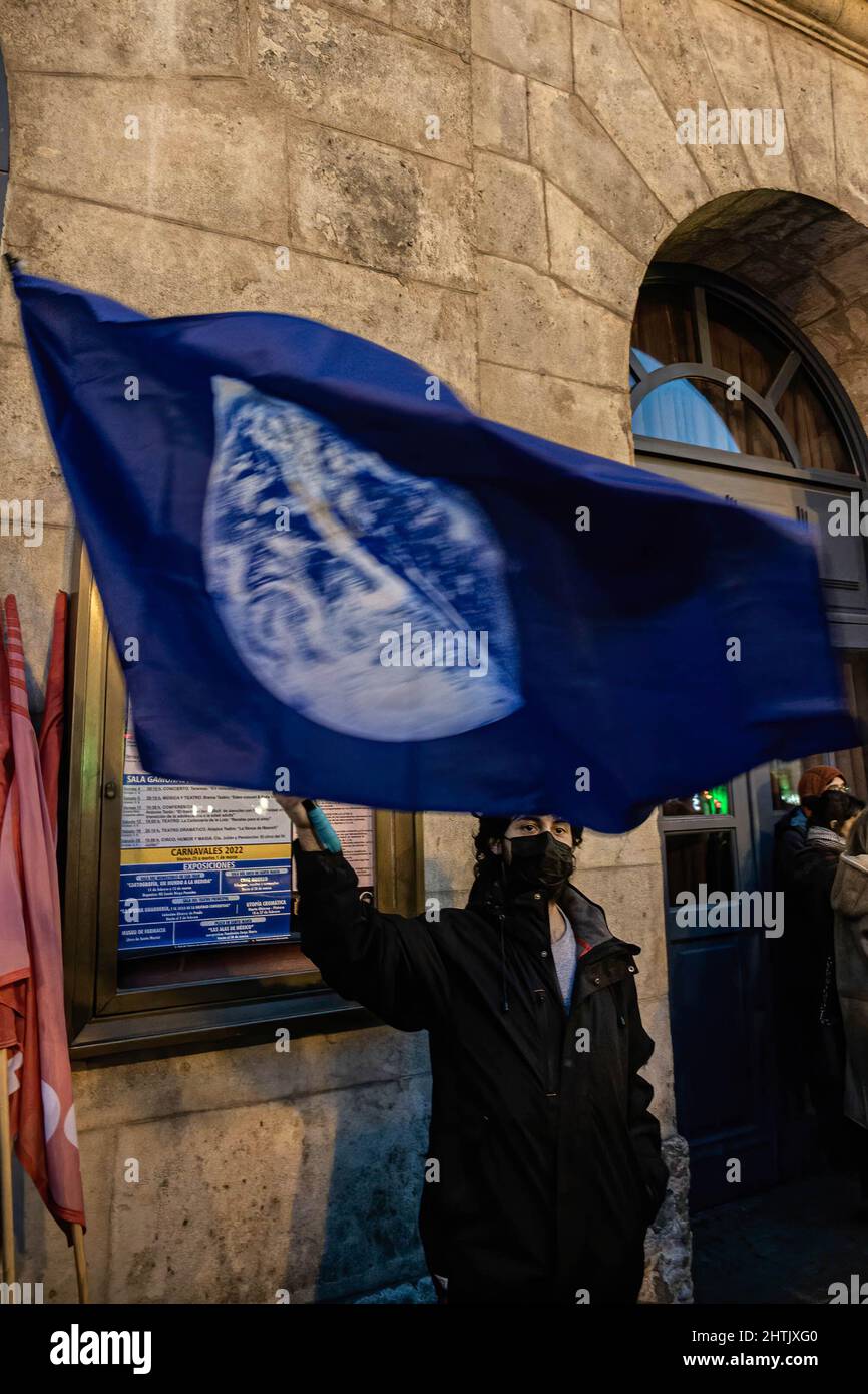 Burgos, Spain. 27th Feb, 2022. A protester waves a flag of the earth during the demonstration.A large number of Ukrainian demonstrators concentrated in the city of Burgos to claim the end of the war in Ukraine. (Credit Image: © Jorge Contreras/SOPA Images via ZUMA Press Wire) Stock Photo