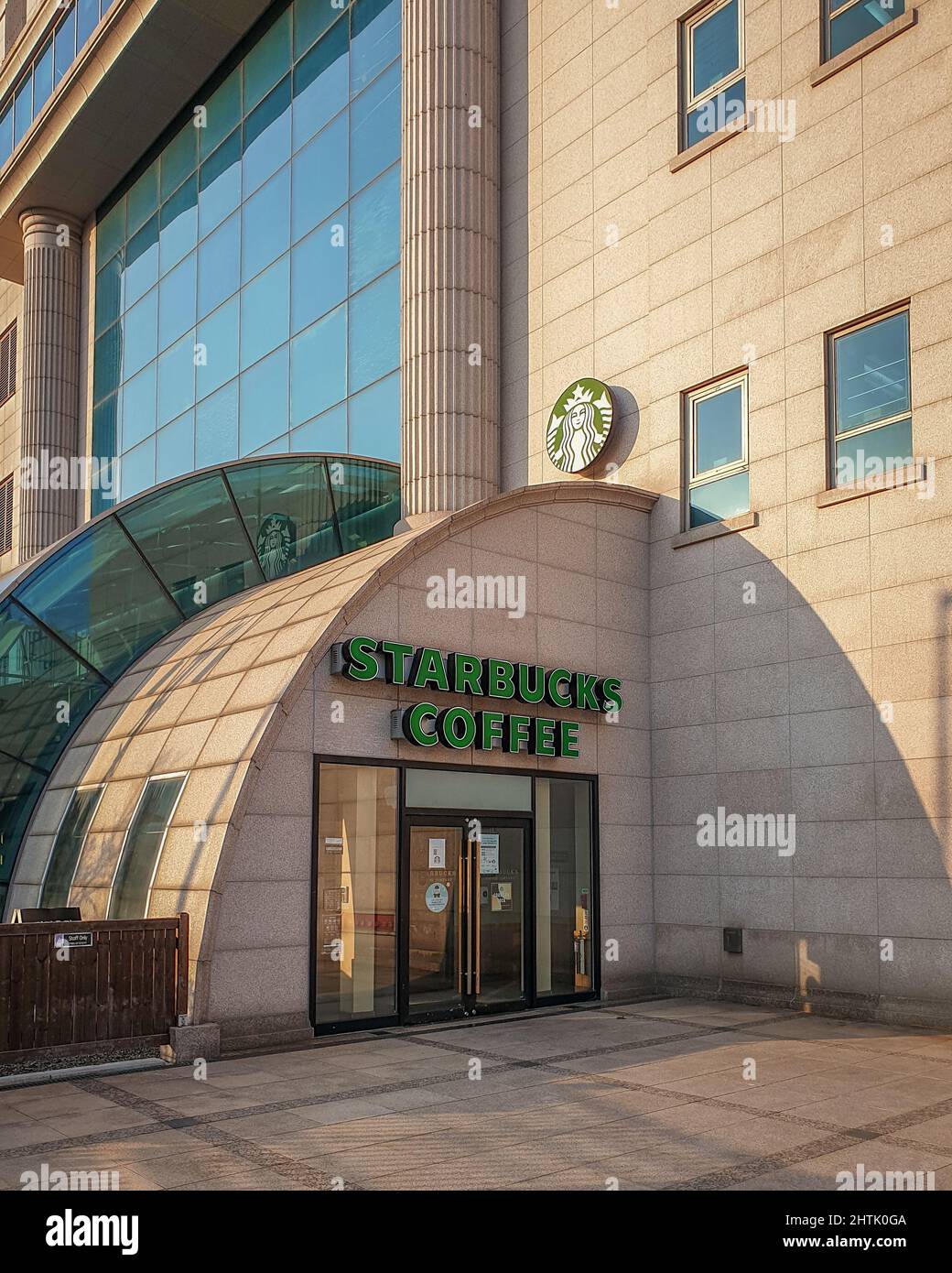 Ulsan, South Korea - Starbucks coffee store located at the Hyundai Department Store. The largest coffeehouse company in the world. Stock Photo