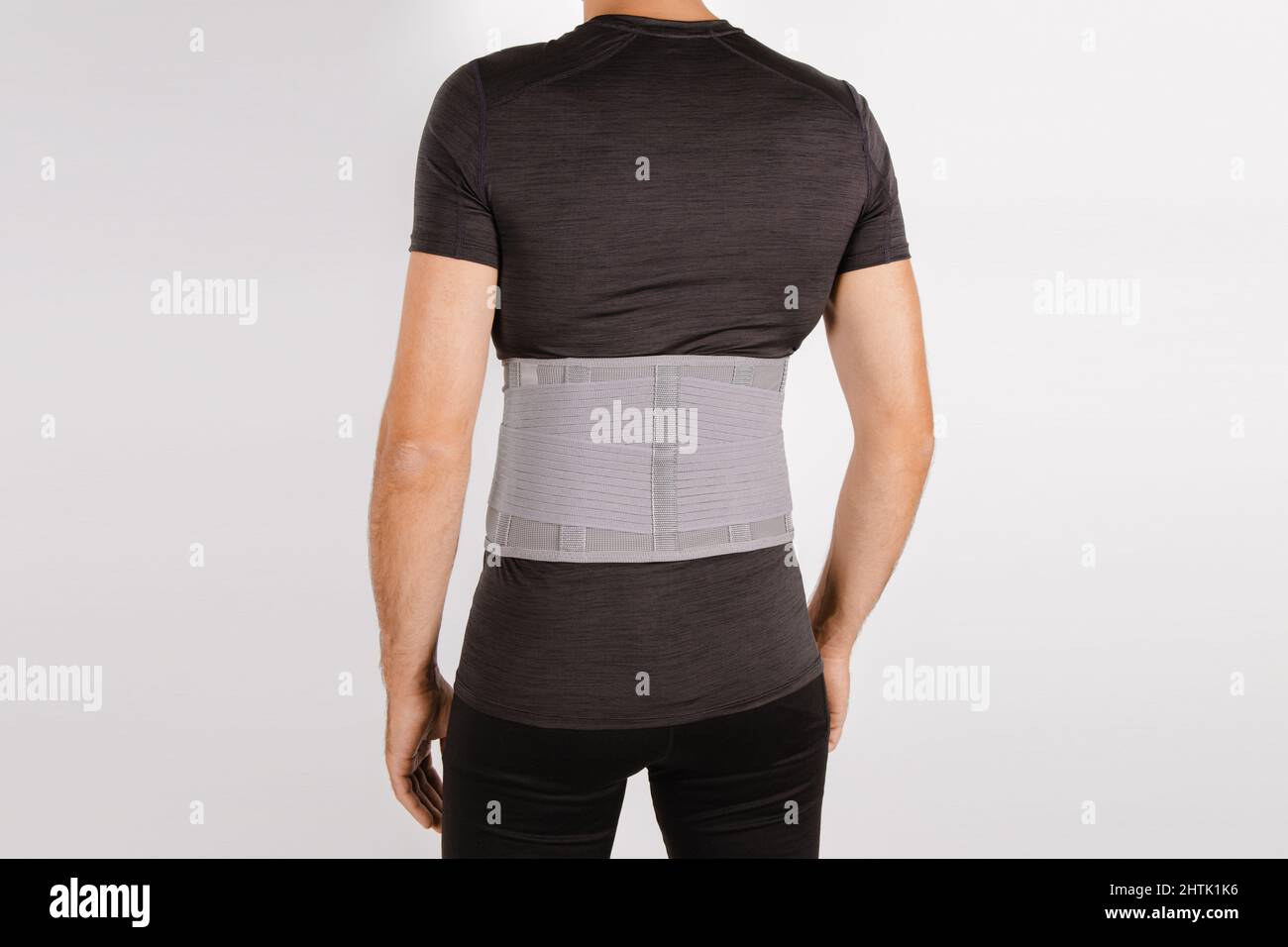 Lumbar brace on the human body isolated on a white background. Trauma of  back. Back brace, orthopedic lumbar, support belt for back muscles. Lower  Stock Photo - Alamy