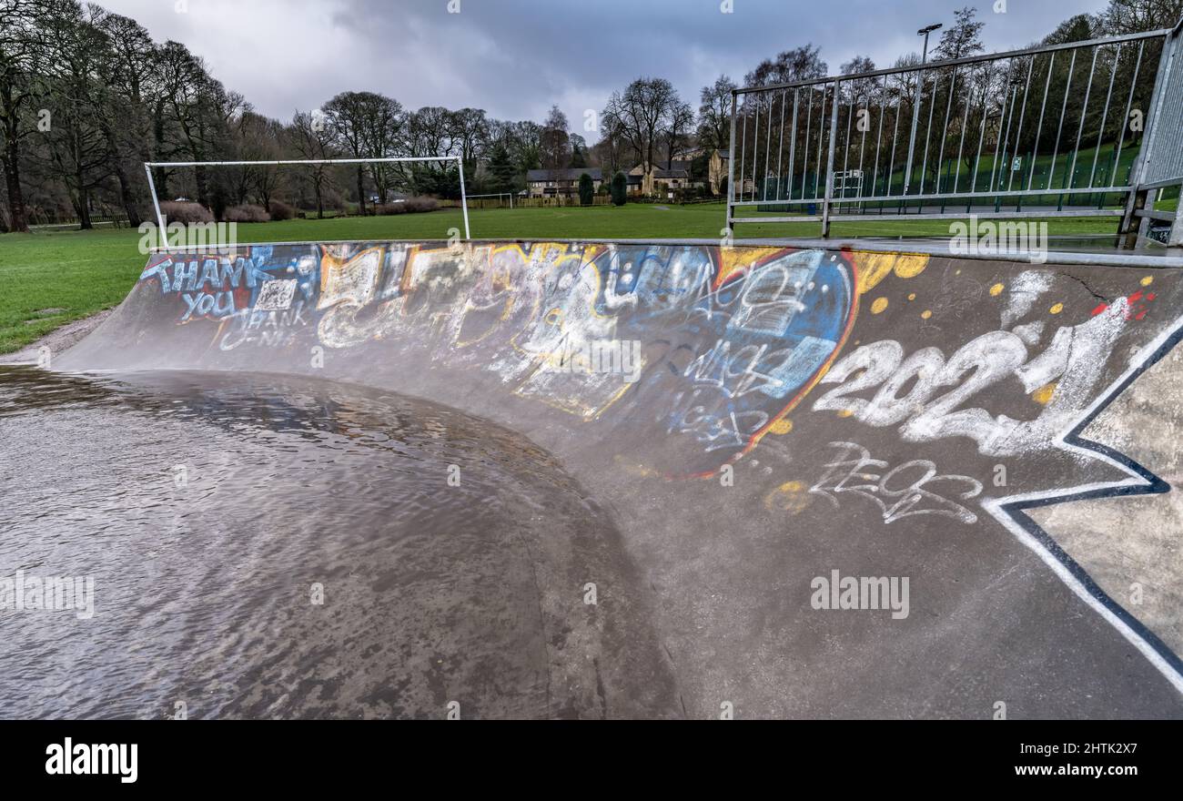 Waterlogged skatepark and recreational grounds, no children due to weather. School holidays letdown, Stock Photo