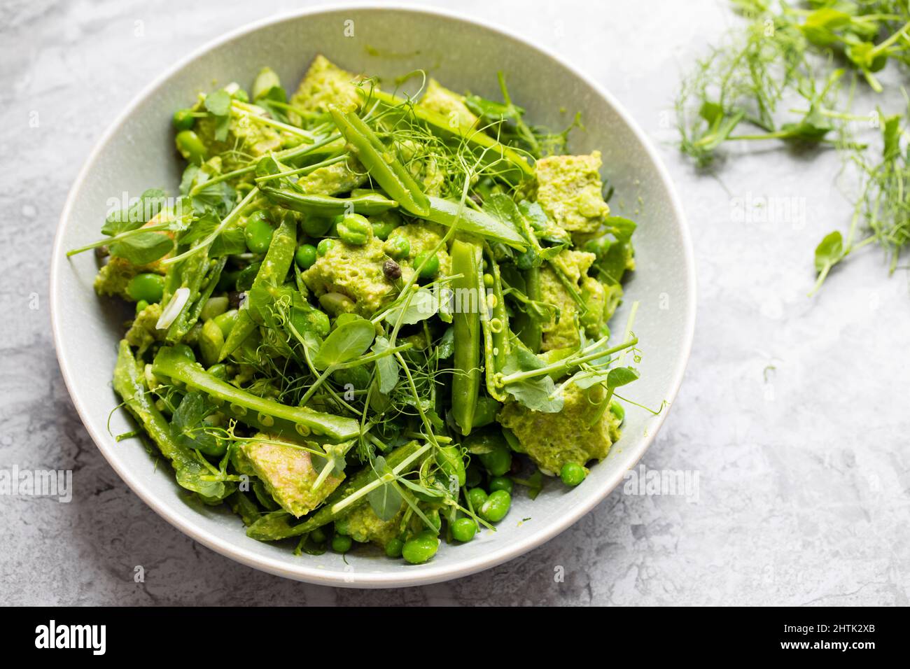 Pea shoots and broad beans panzanella Stock Photo Alamy