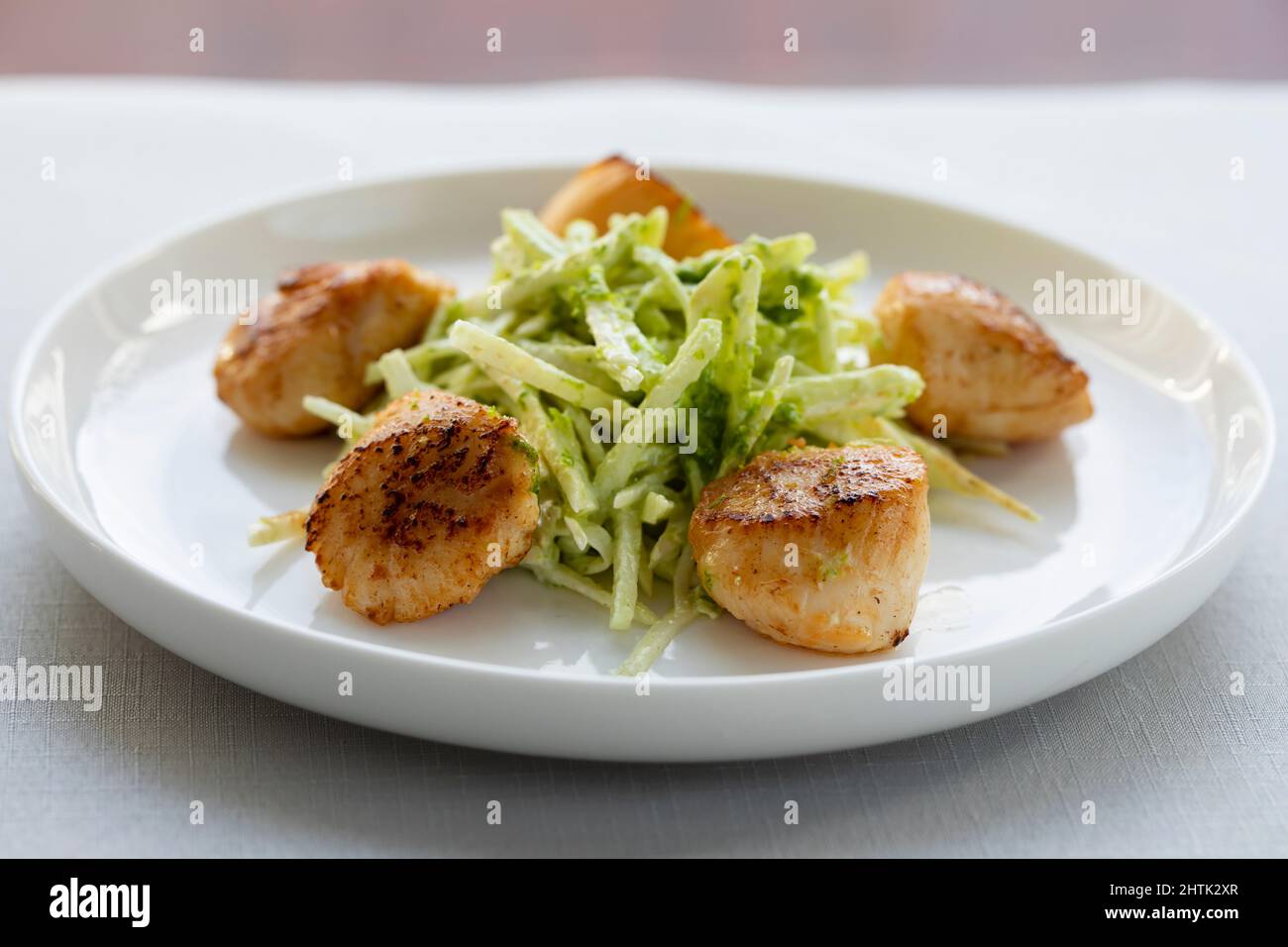 Pan fried scallops with celeriac salad Stock Photo