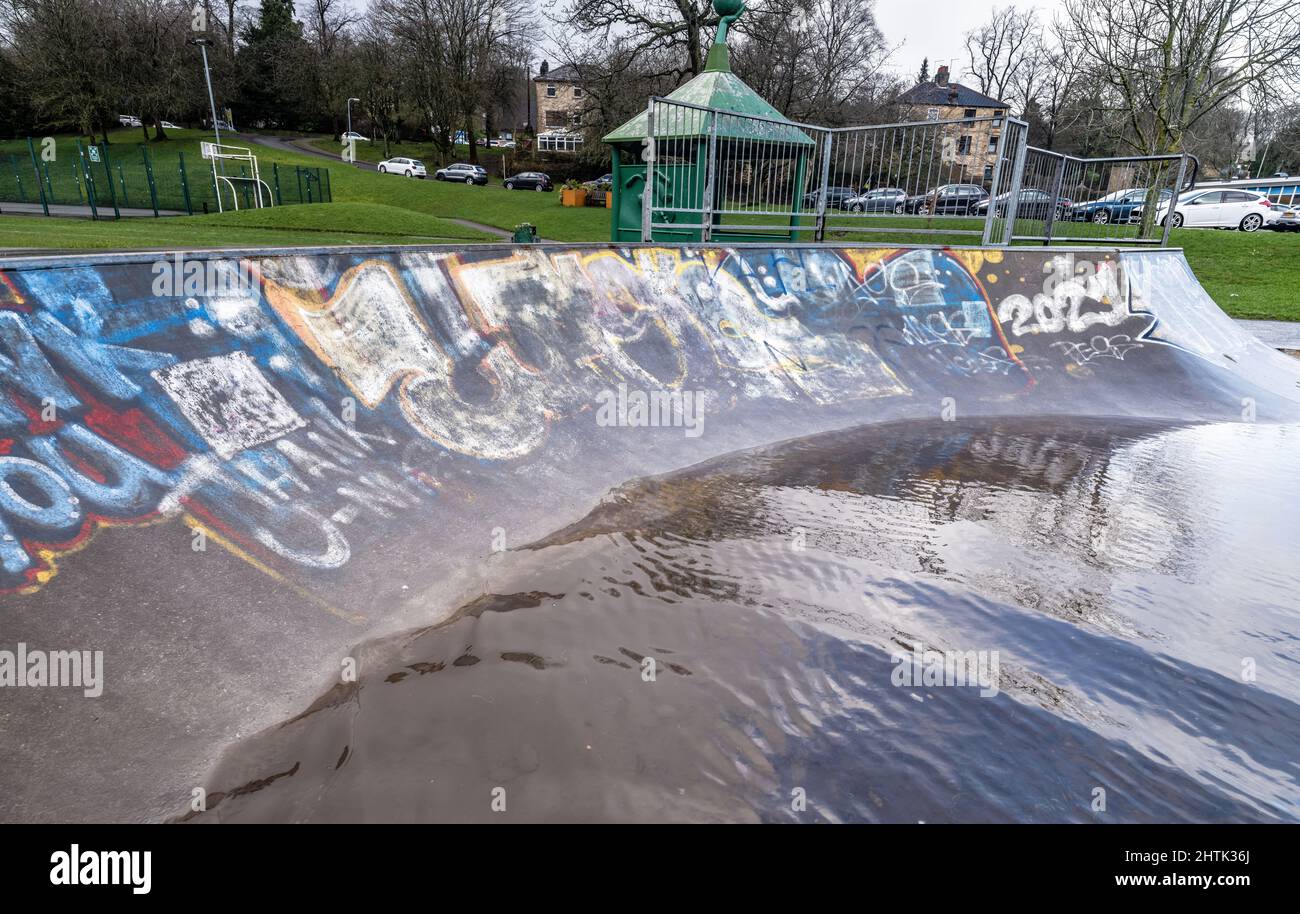 Waterlogged skatepark and recreational grounds, no children due to weather. School holidays letdown, Stock Photo