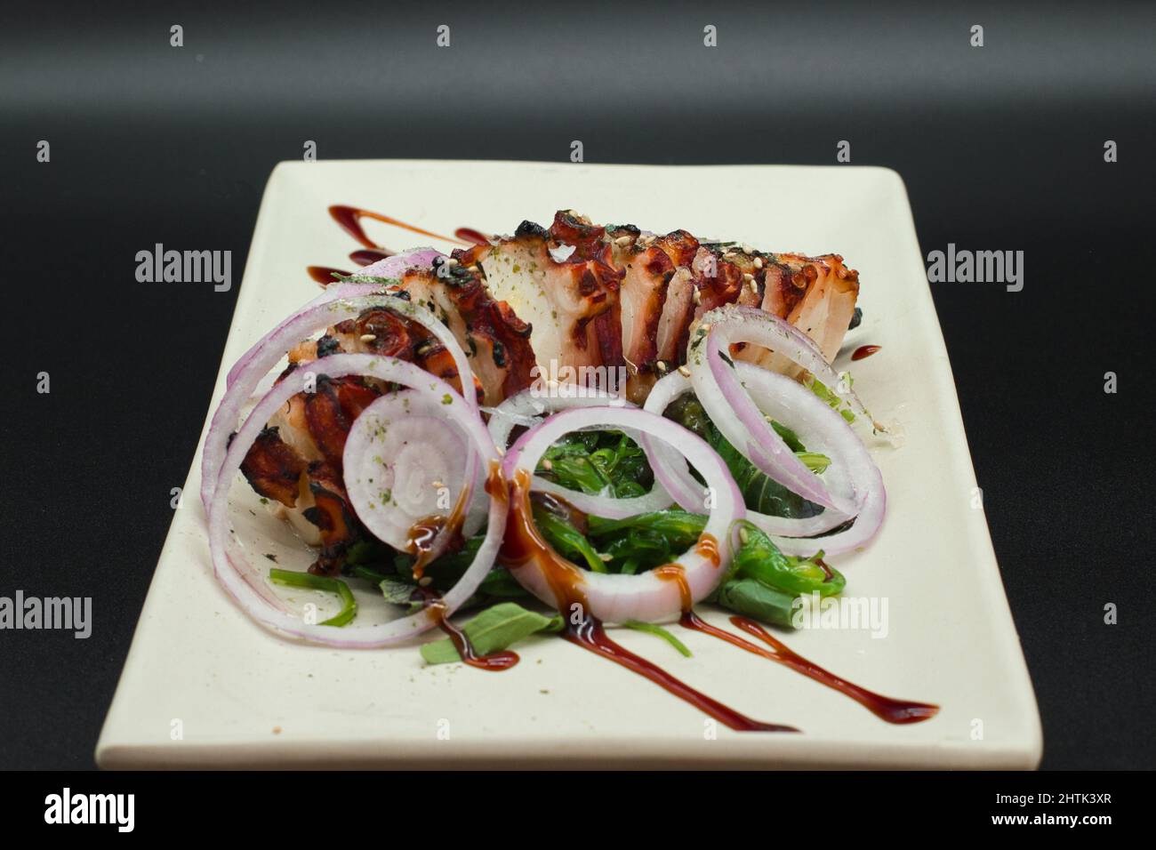 Japanese Octopus Salad, sliced fresh octopus with seaweed, onion and