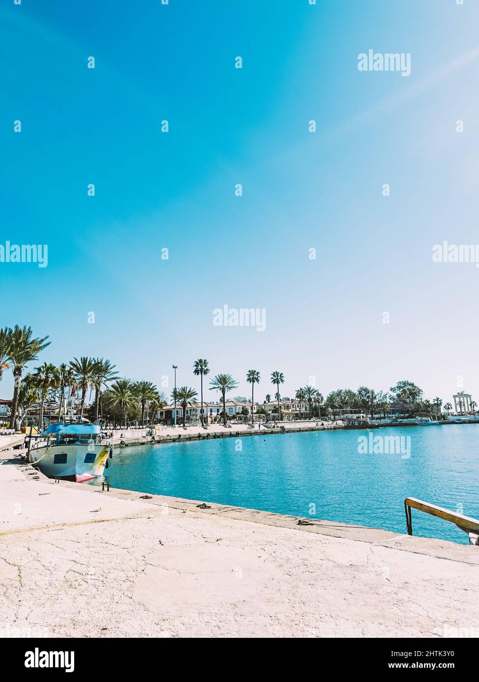 Beautiful sea promenade with boats and palm trees Stock Photo - Alamy