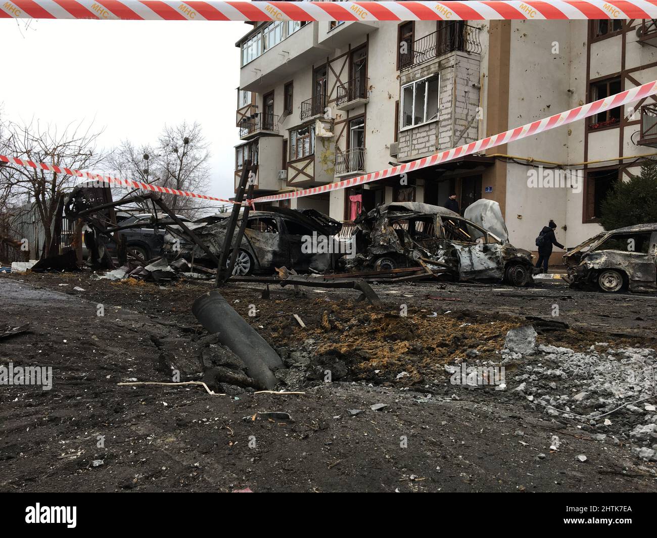 Kharkiv, Ukraine. Russian missile strike to the schoolyard, school #108, of Kharkiv, at 5 a.m., of the March 01/03/2022, in front of the apartment house, with many burned cars, wounded people, destroyed school building and the house Credit: Gusty/Alamy Live News Stock Photo