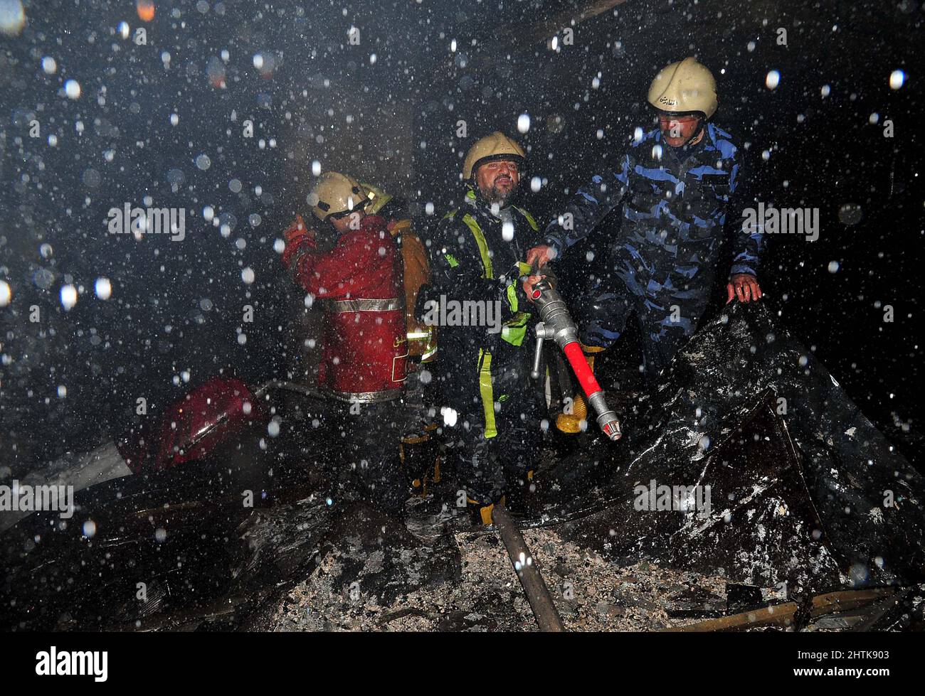 Damascus, Syria. 1st Mar, 2022. Firefighters are seen after a fire broke out at the Lamirada mall in Damascus, Syria, March 1, 2022. As many as 11 people were killed and seven others wounded when a fire broke out at a shopping mall in the center of the capital Damascus earlier on Tuesday. Credit: Ammar Safarjalani/Xinhua/Alamy Live News Stock Photo