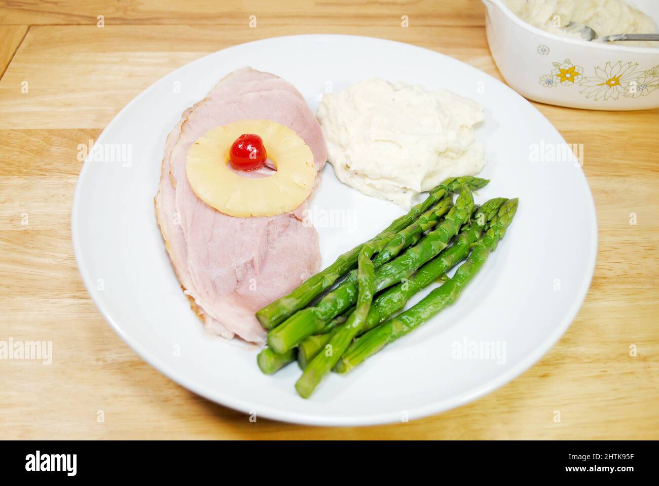 Delicious Ham Dinner with Mashed Potatoes and Fresh Steamed Asparagus