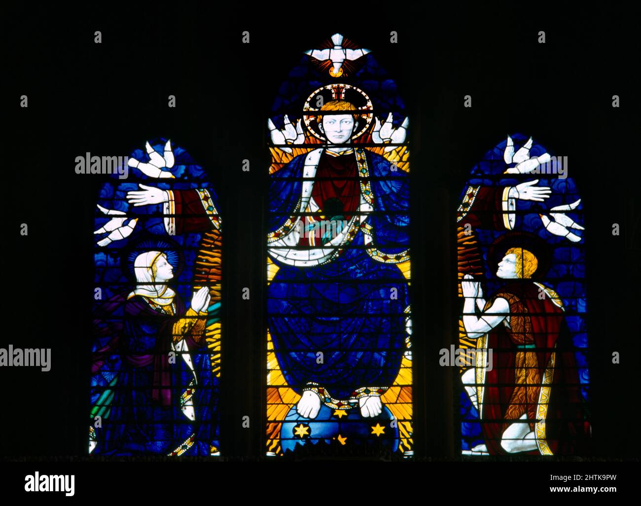 Southwark Cathedral London England Stained Glass Window of Christ in Majesty with the Virgin Mary and Saint John the Evangelist, Jesus Christ Sits abo Stock Photo