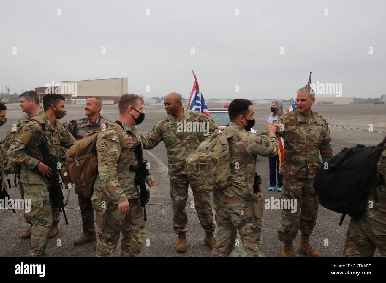 Savannah, United States. 27th Feb, 2022. U.S. Army soldiers, assigned to the 1st Armored Brigade Combat Team, 3rd Infantry Division, are fist bumped by commanding officers as they board a civilian aircraft for deployment to NATO countries from Hunter Army Airfield, February 27, 2022 in Savannah, Georgia. The soldiers are deploying to Eastern Europe in support of NATO allies and deter Russian aggression toward Ukraine. Credit: Capt. John D. Howard Jr/U.S Army/Alamy Live News Stock Photo