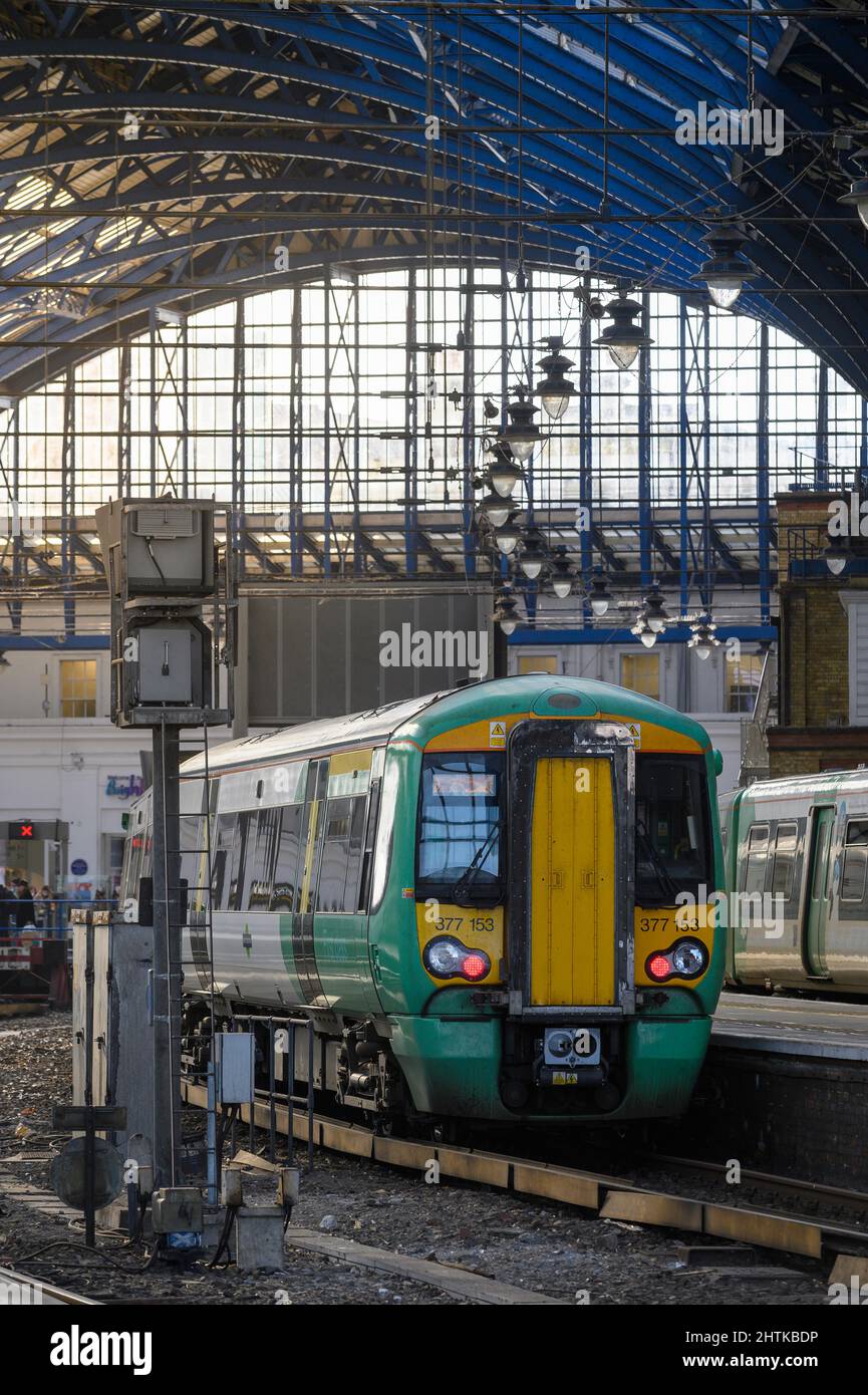 British rail class 377 train in Southern livery waiting at a platform in Brighton Railway Station, England. Stock Photo