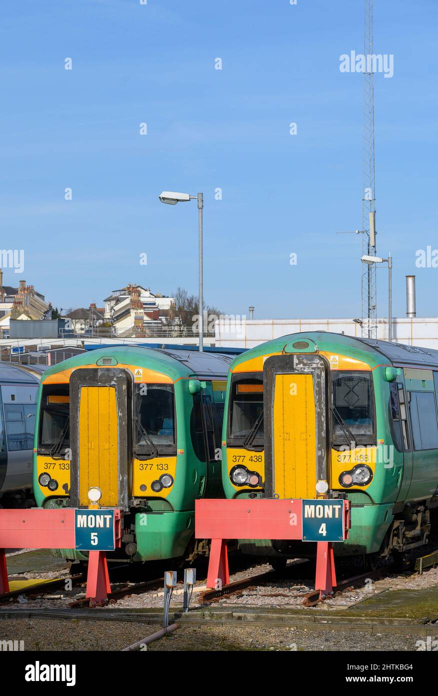 British rail class 377 trains in Southern livery, waiting outside Brighton Railway Station, England. Stock Photo