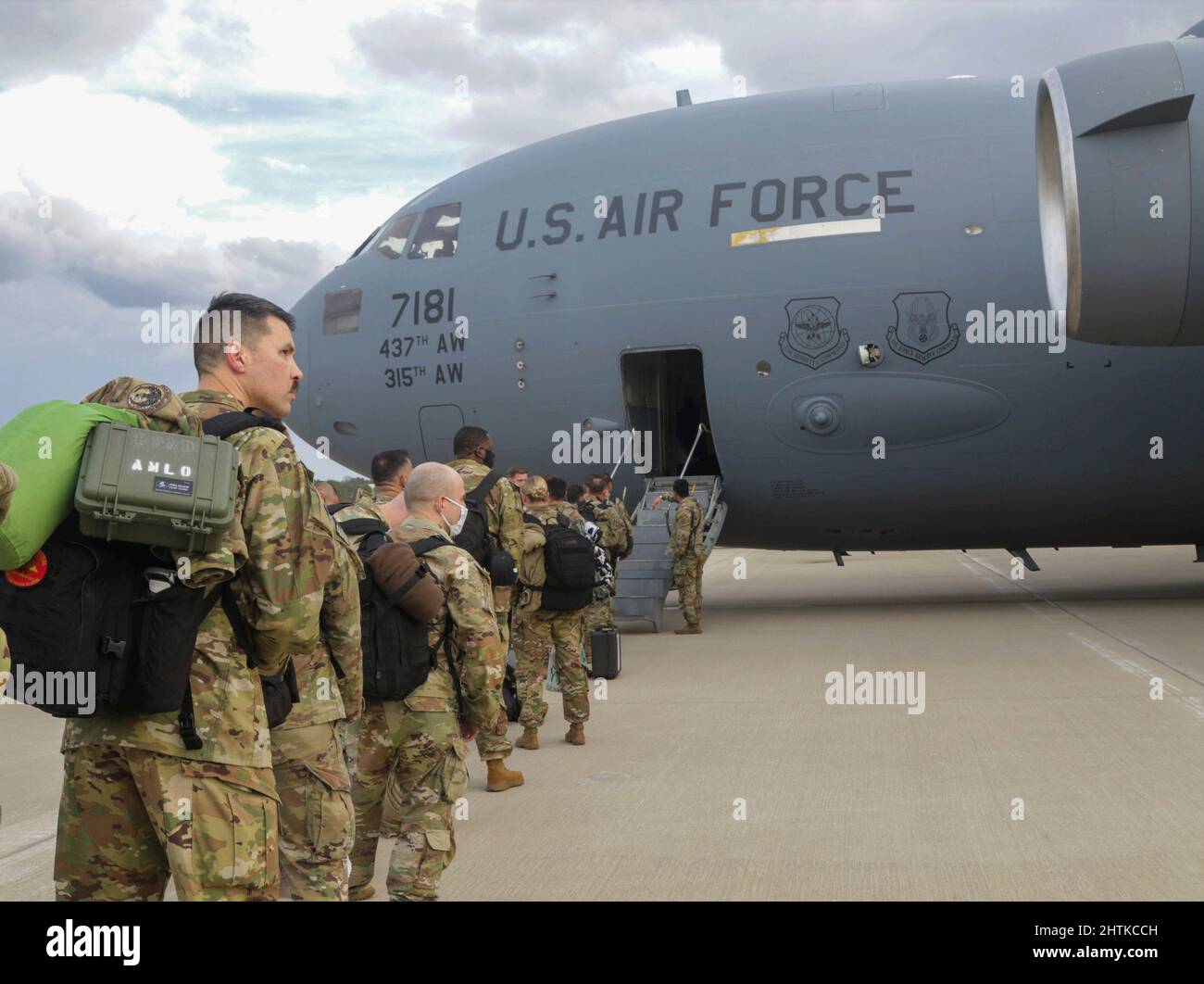 Fort Bragg, United States. 04 February, 2022. U.S. Army paratroopers, with the 82nd Airborne Division, board a C-17 Globemaster III transport aircraft for deployment to Poland from Fort Bragg airfield, February 4, 2022 in Fort Bragg, North Carolina. The soldiers are deploying to Eastern Europe in support of NATO allies and deter Russian aggression toward Ukraine. Credit: Spc. Casey Brumbach/U.S Army/Alamy Live News Stock Photo