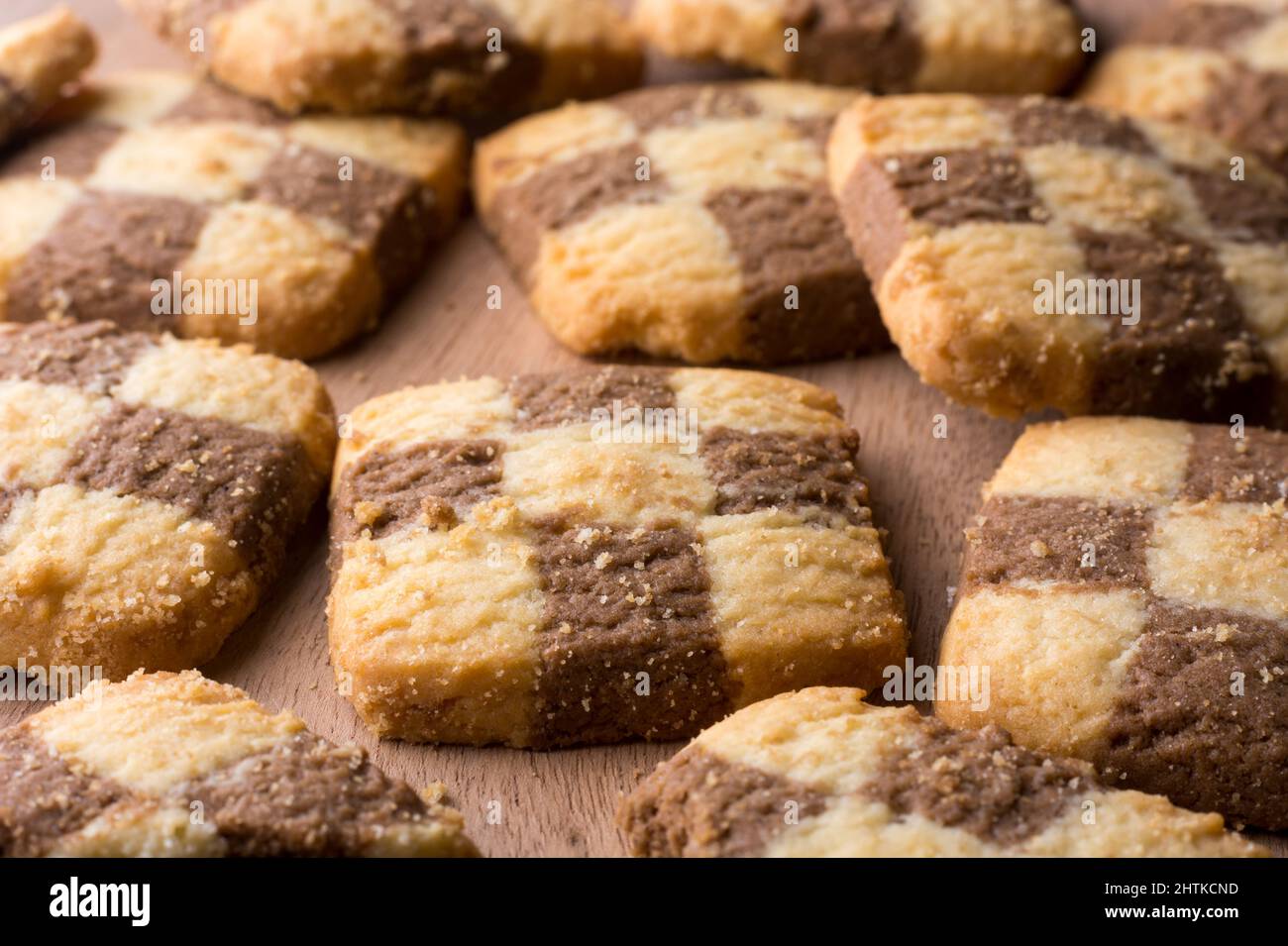 chequered biscuits, closeup view of cookies, square shape snack taken in shallow depth of field Stock Photo