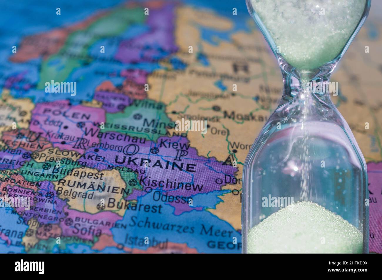 color geographic map of europe and ukraine with an hourglass in the foreground Stock Photo