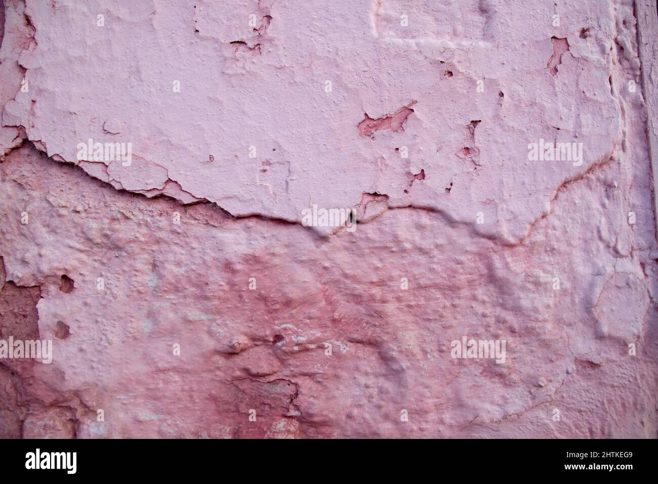 Pink worn embossed wall surface texture Stock Photo