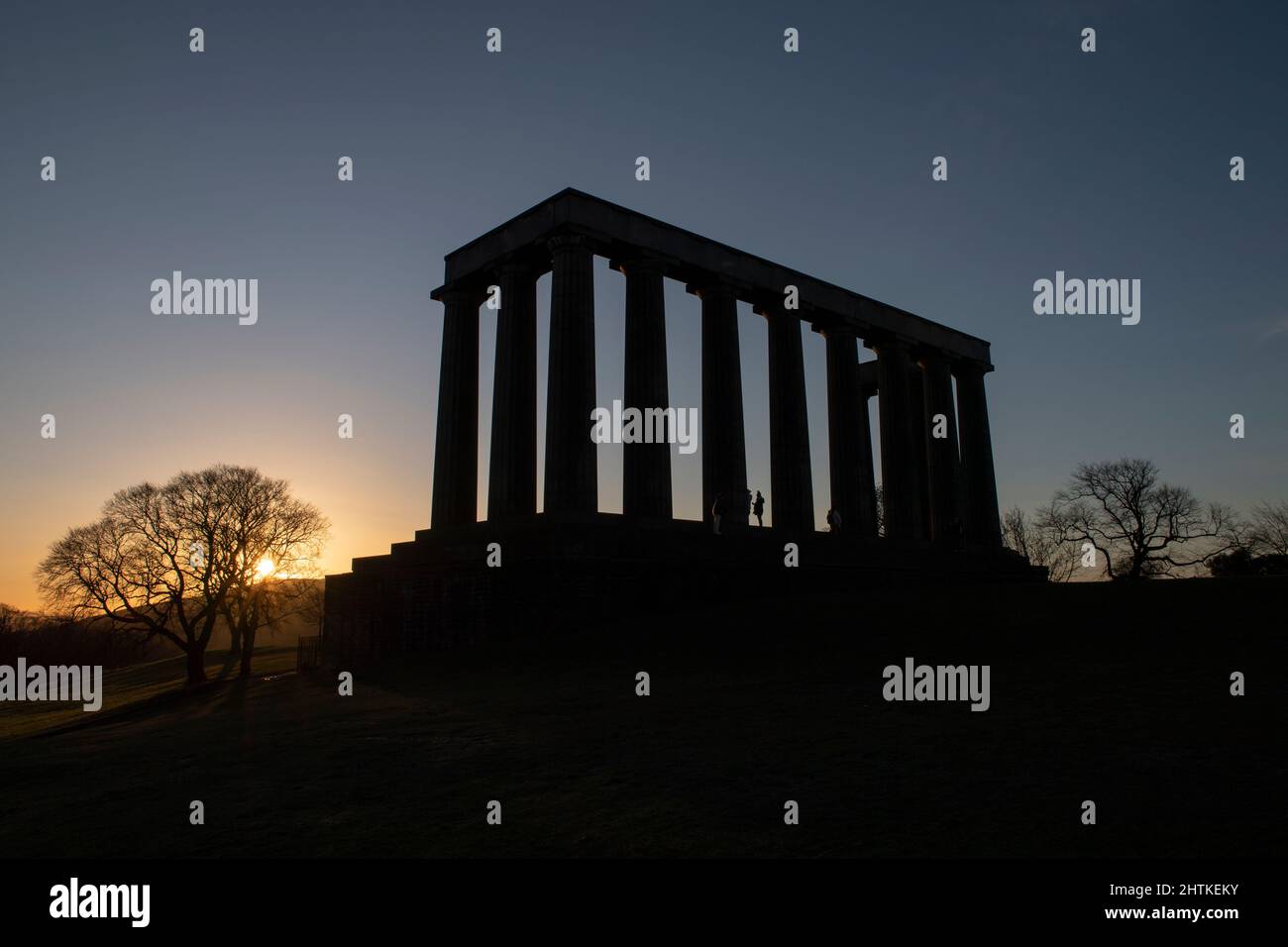 Sunrise at the National Monument of Scotland on Calton Hill in Edinburgh, Scotland. Stock Photo