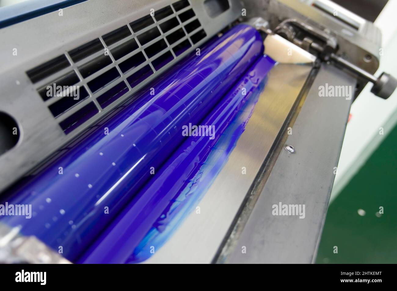 Offset machine printing blue ink Stock Photo
