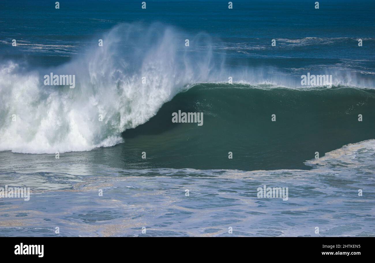 Perfect wave breaking in a beach. Surf spot Stock Photo