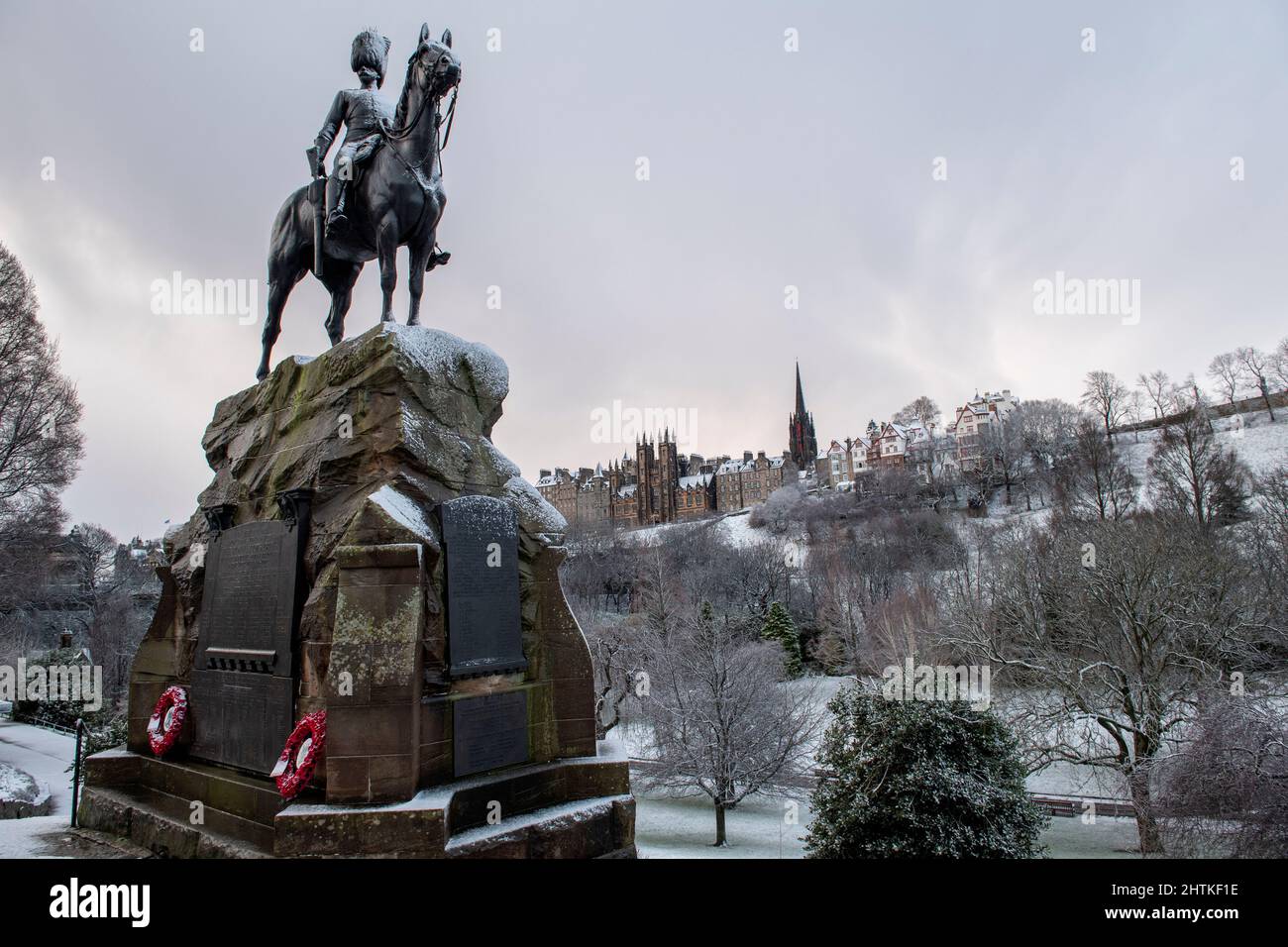 The Royal Scots Greys Monument and Princes Street Gardens covered in snow, Edinburgh, Scotland Stock Photo