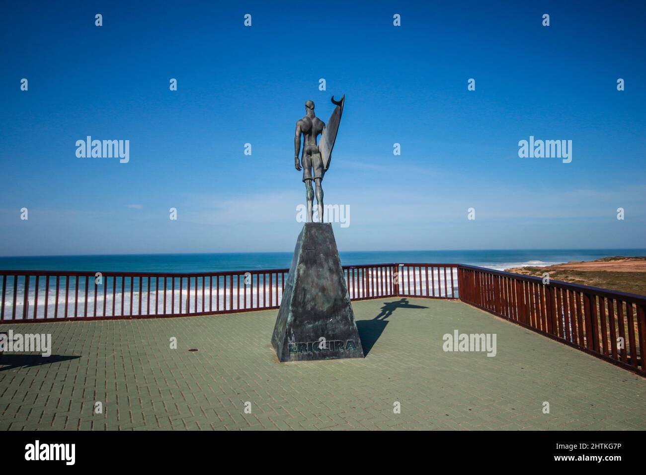 Statue of a surfer in the beach of Ribeira d’Ilhas World Surf Reserve. Stock Photo