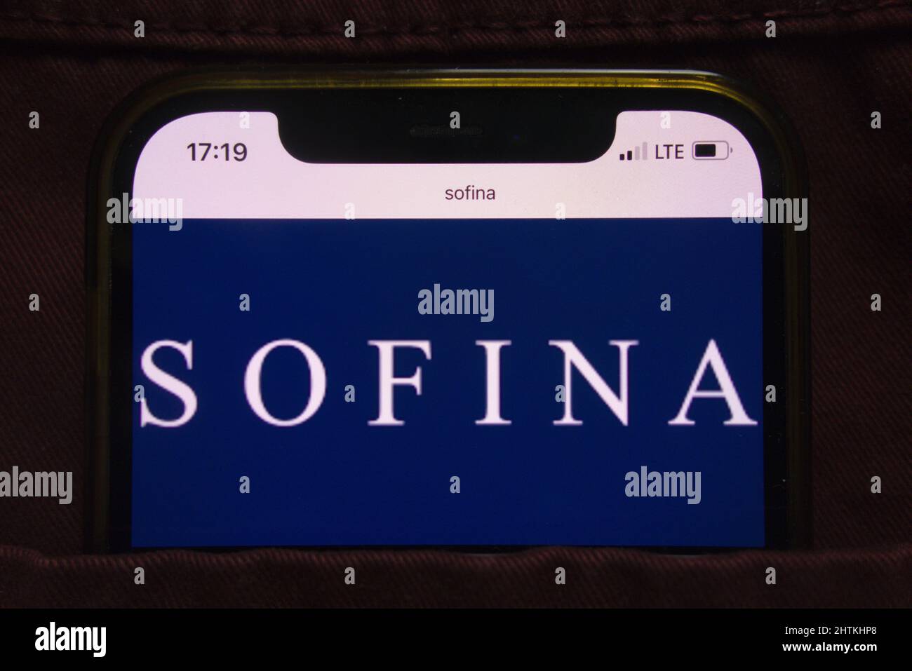 KONSKIE, POLAND - February 27, 2022: Sofina company logo displayed on mobile phone hidden in jeans pocket Stock Photo